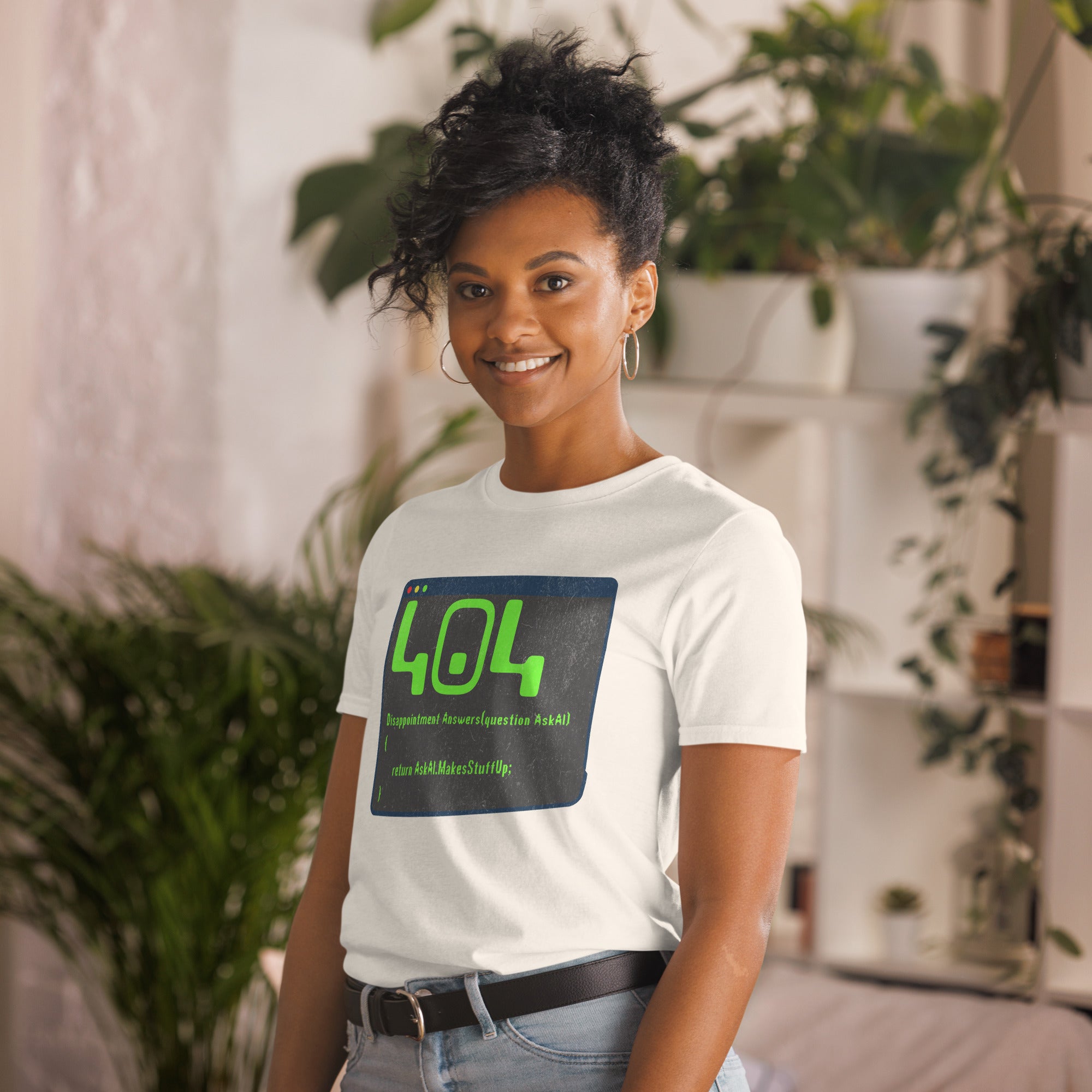 Woman wearing '404 Disappointment Error' T-shirt, AI humor for developers, in a modern indoor setting.