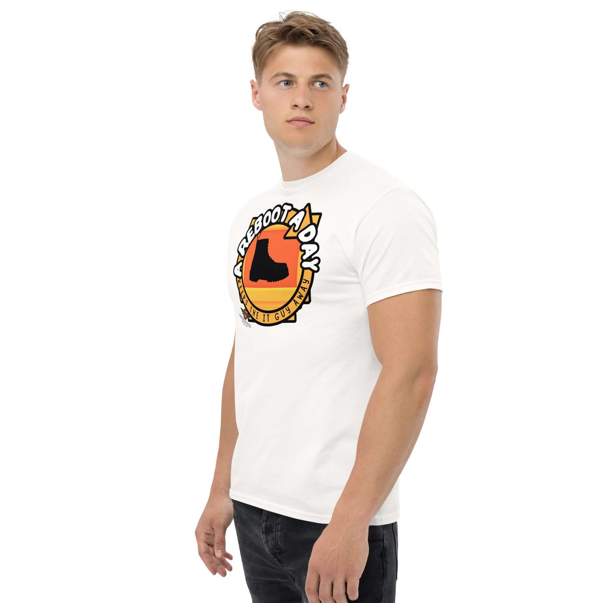 A Reboot A Day IT support humor t-shirt featuring combat boot design on a sunset backdrop, worn by a male model.