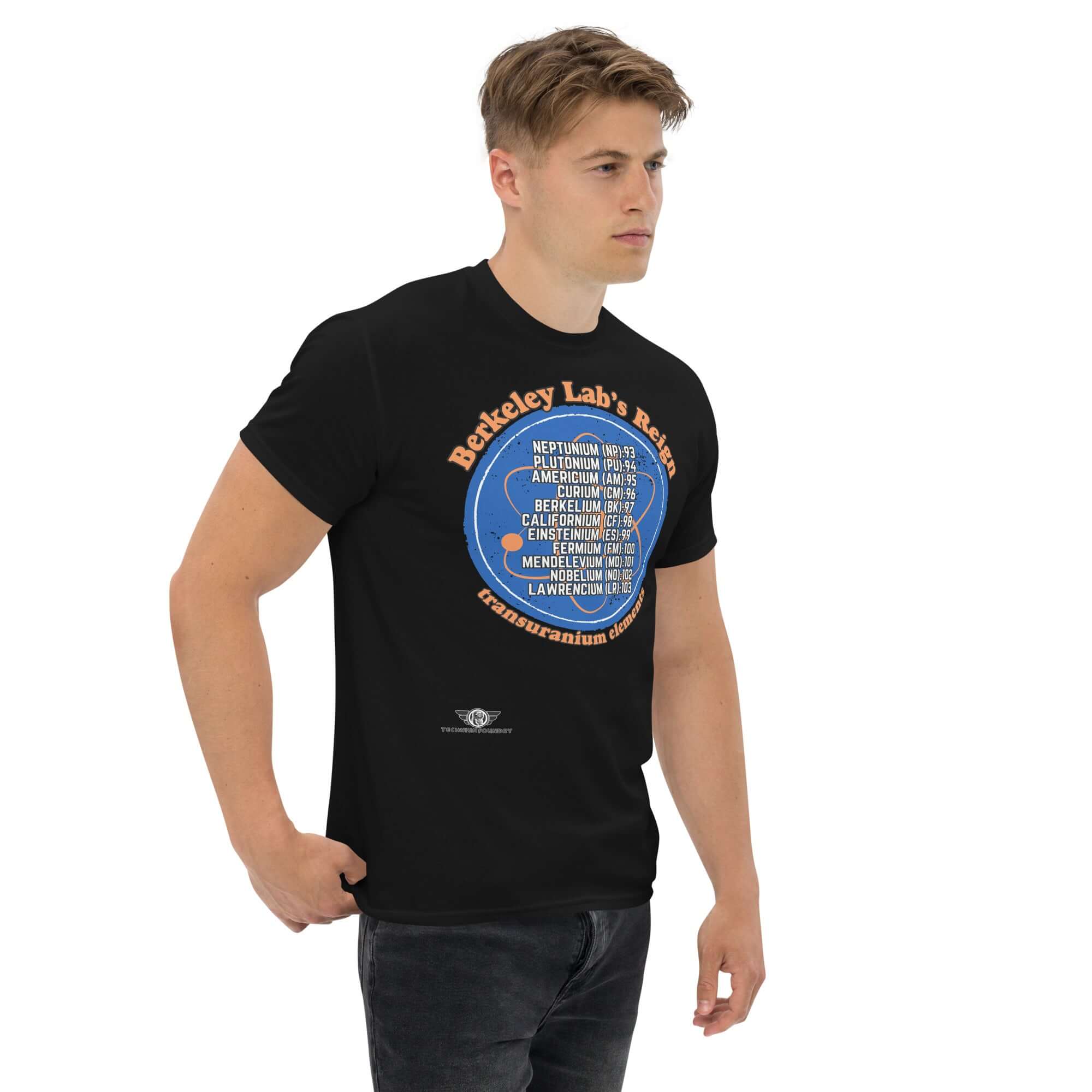 Berkeley Lab's Reign Transuranium Elements T-Shirt, featuring a scientific circle design on a deep blue background worn by model.