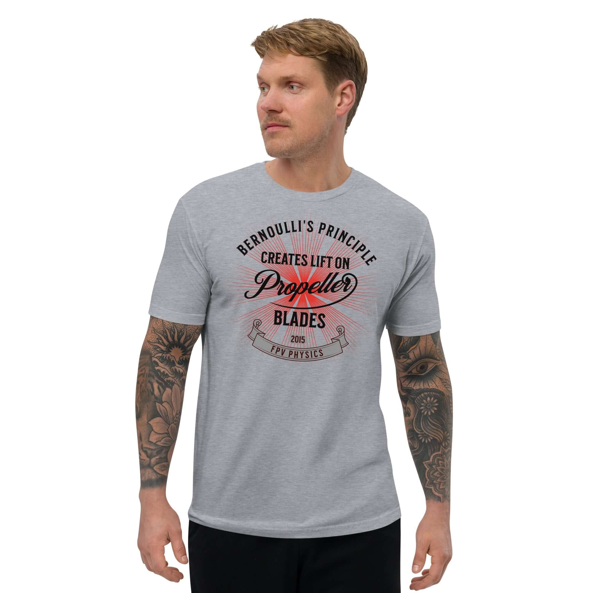 Man wearing 'Bernoulli's Principle Creates Lift on Propeller Blades' drone technology tee, showcasing aerodynamics-themed style.