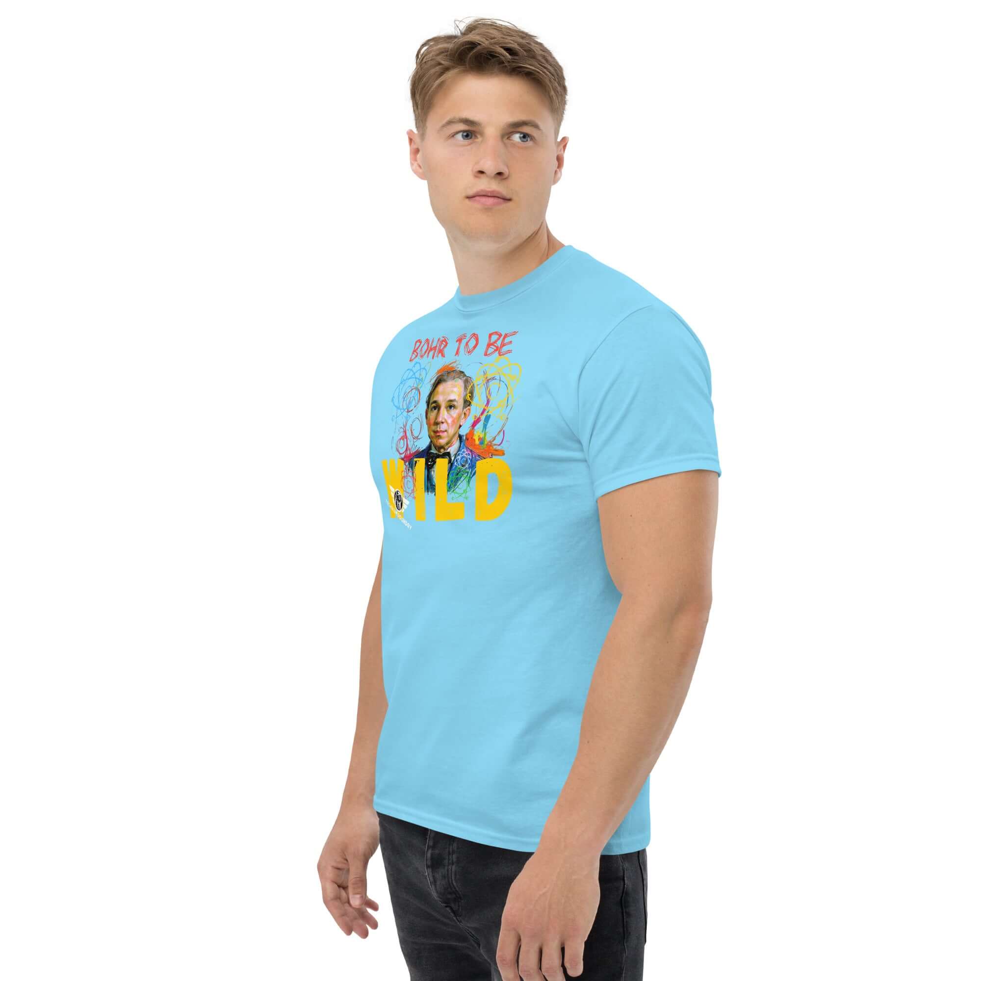 Bohr to Be Wild t-shirt featuring Niels Bohr portrait blending rock & roll and quantum art, worn by a model in a casual stance.