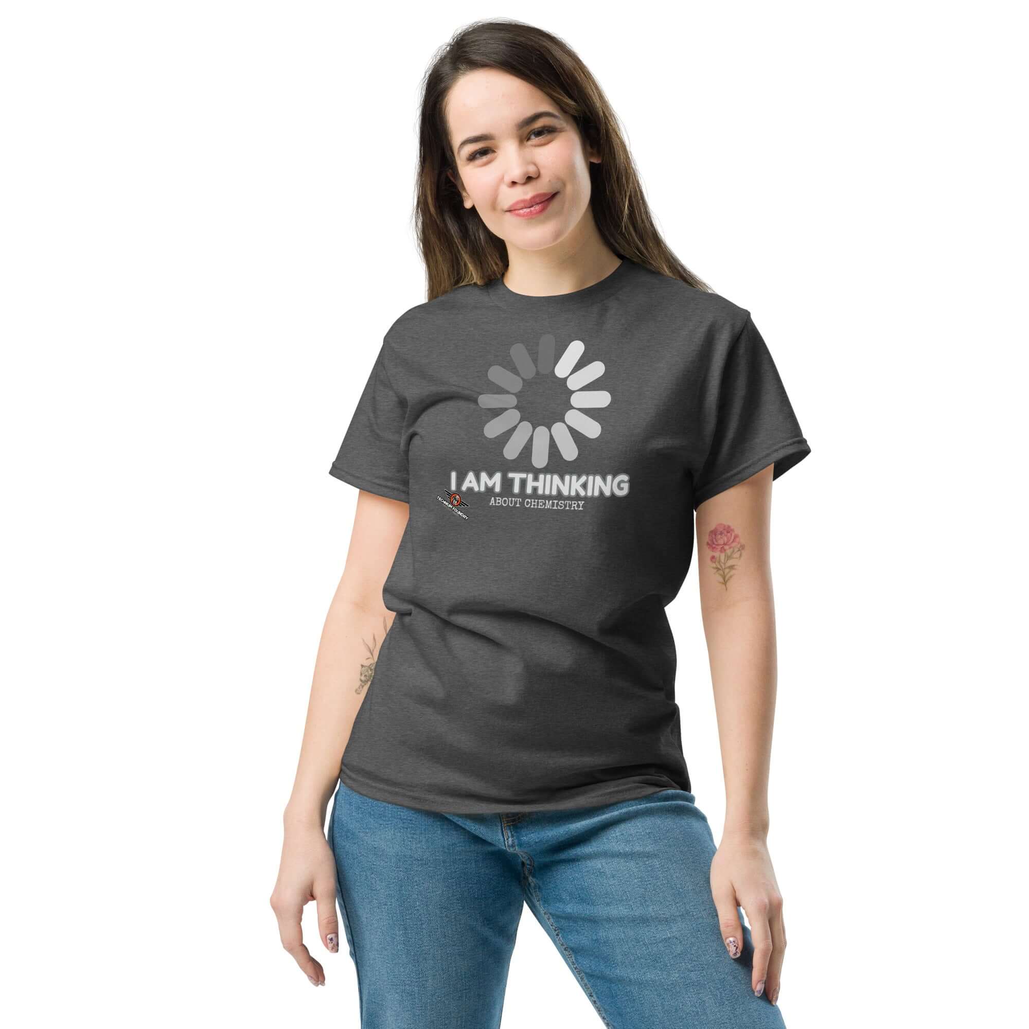 Woman wearing a black 'I Am Thinking About Chemistry' t-shirt with a loading icon, symbolizing processing chemical reactions.