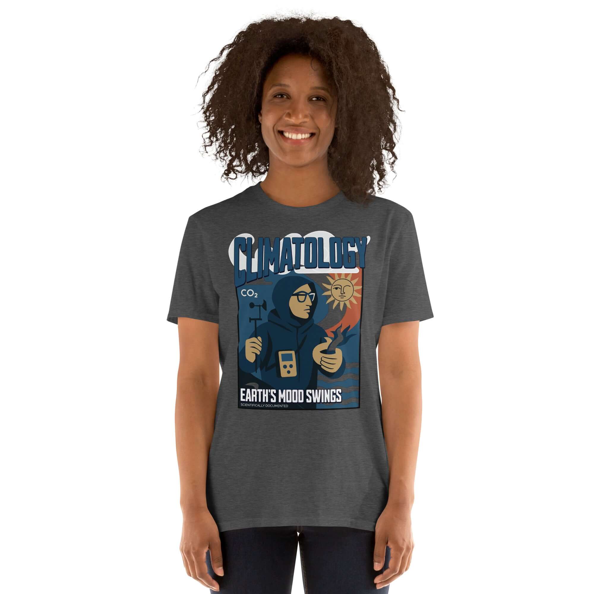 Woman wearing a 'Climatology: Earth's Mood Swings' t-shirt with a vintage weather-themed design.