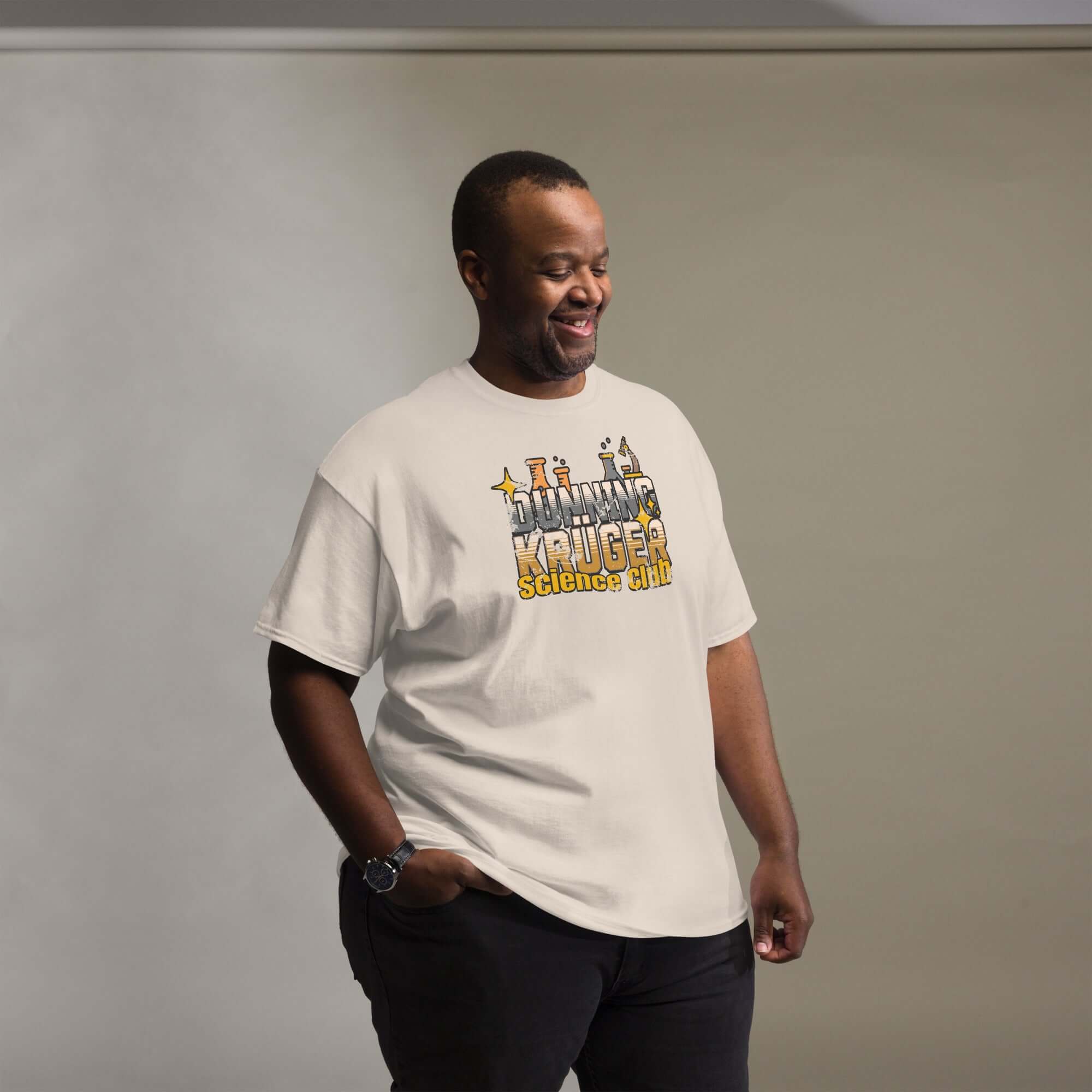 Man wearing a Dunning-Kruger Science Club T-shirt with metallic gradient text, highlighting the cognitive bias apparel theme.