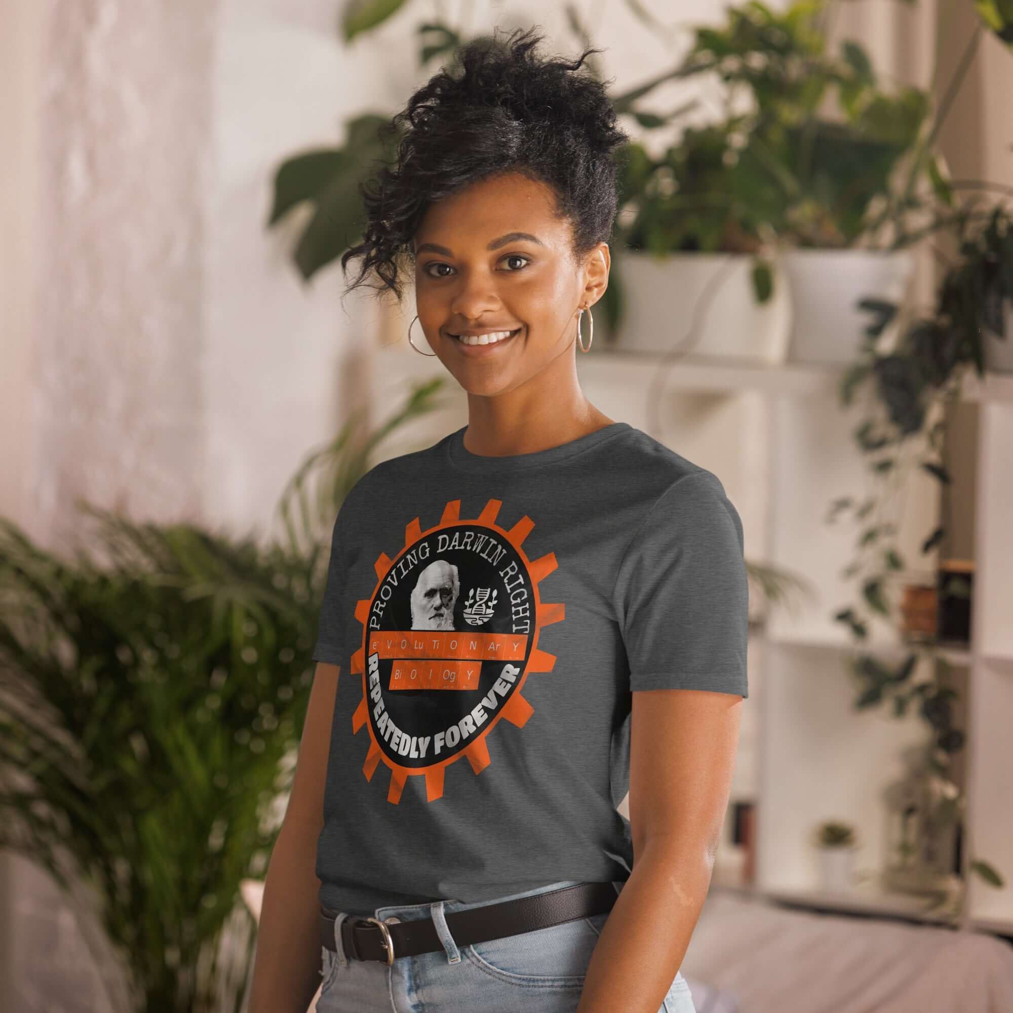 Model wearing 'Proving Darwin Right, Repeatedly Forever' Evolutionary Biology T-Shirt, featuring a bearded Darwin illustration.
