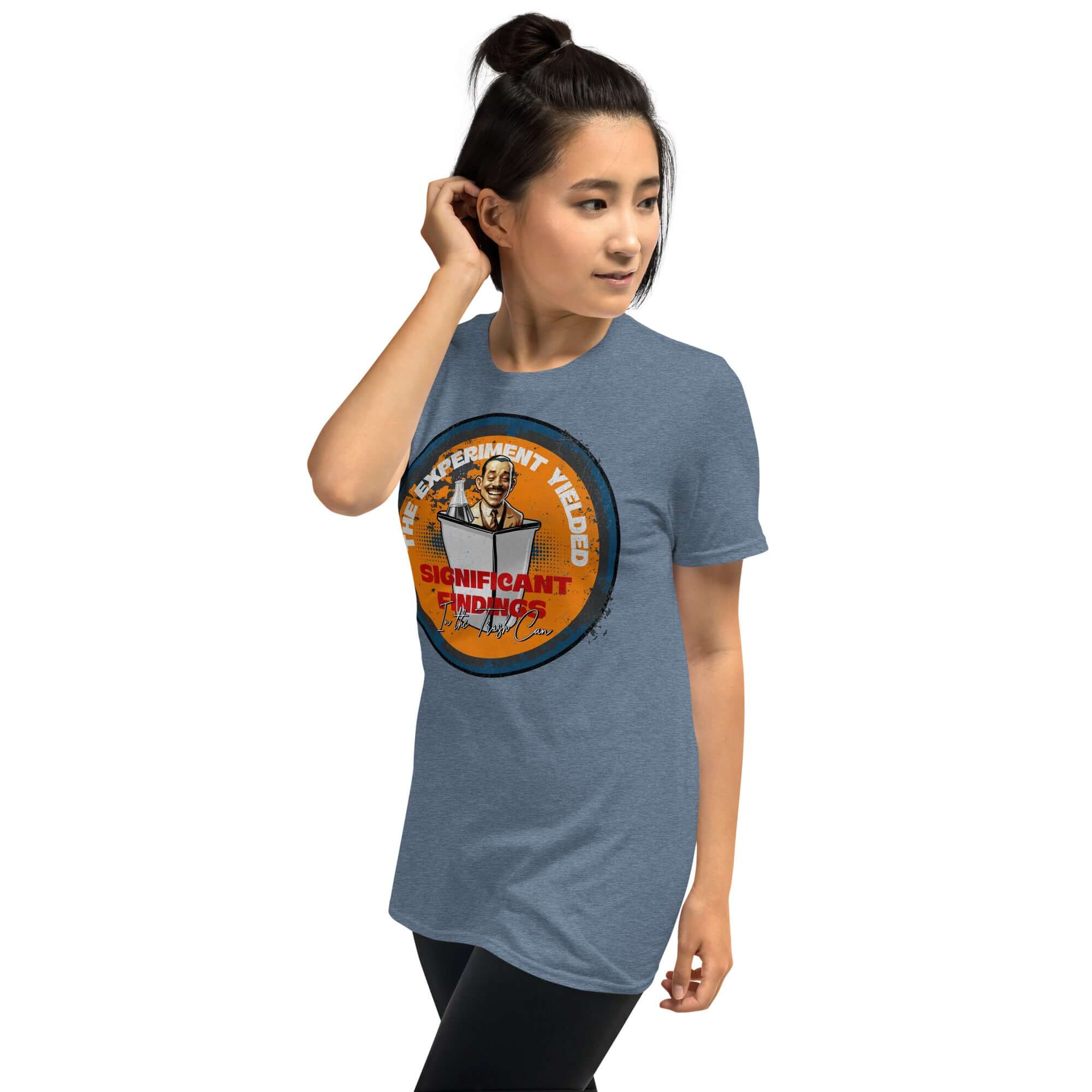 Woman wearing 'The Experiment Yielded Significant Findings' t-shirt with quirky design featuring researcher in trash can.