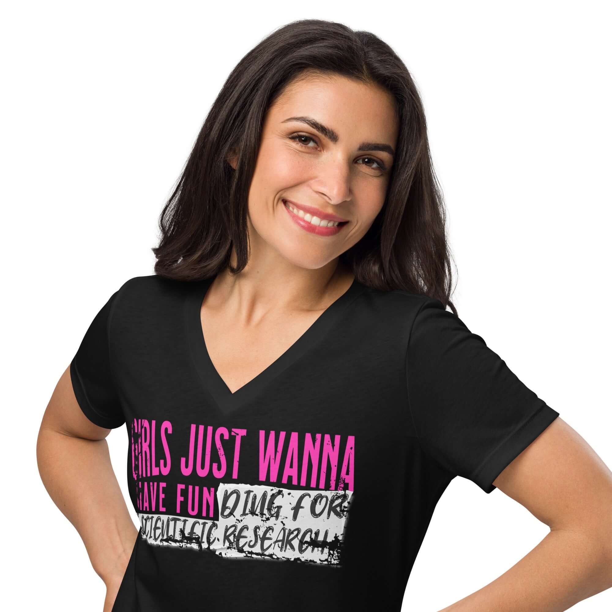 Woman wearing 'Girls Just Wanna Do Science' T-shirt with pink and black text, blending pop culture with science theme.