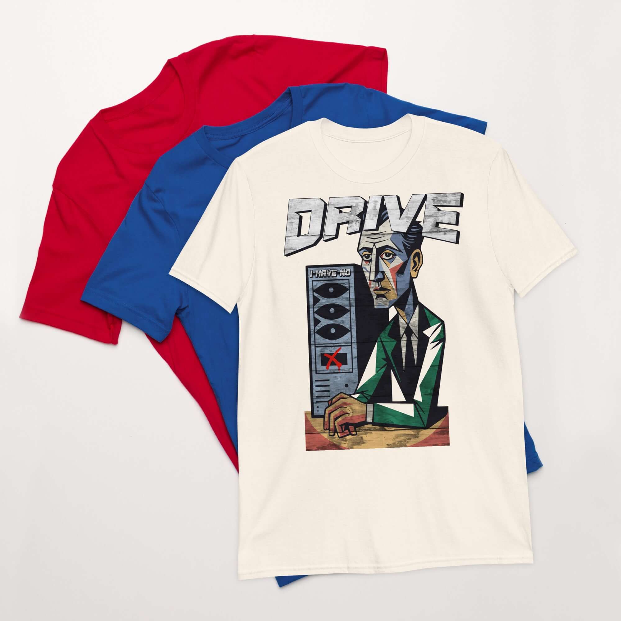 "I Have No Drive" T-Shirt featuring cubist design of computer storage crisis, displayed with red and blue shirts, tech-themed attire.