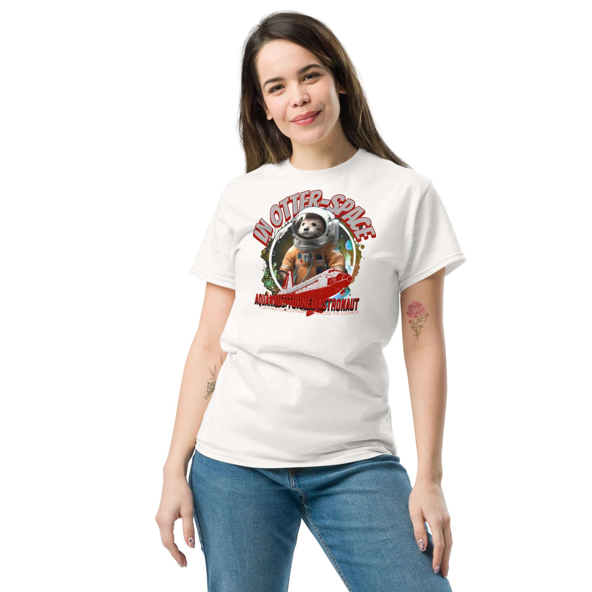 Woman wearing 'In Otter Space' t-shirt featuring otter astronaut in spacesuit, cosmic background, and space shuttle.