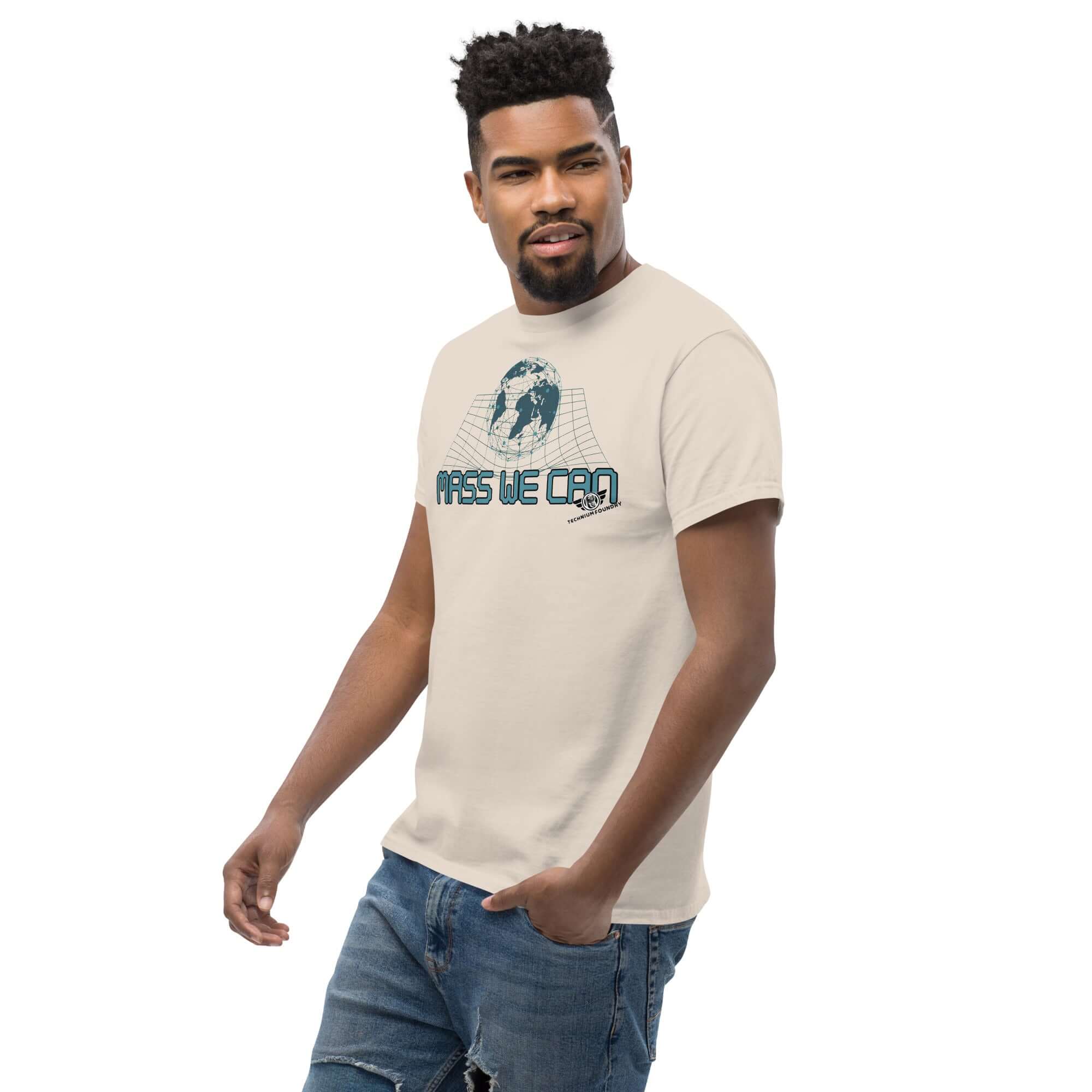 "Mass We Can" T-shirt with space-time curvature design and relativity humor, worn by man, showcasing Einstein-inspired geometric print.