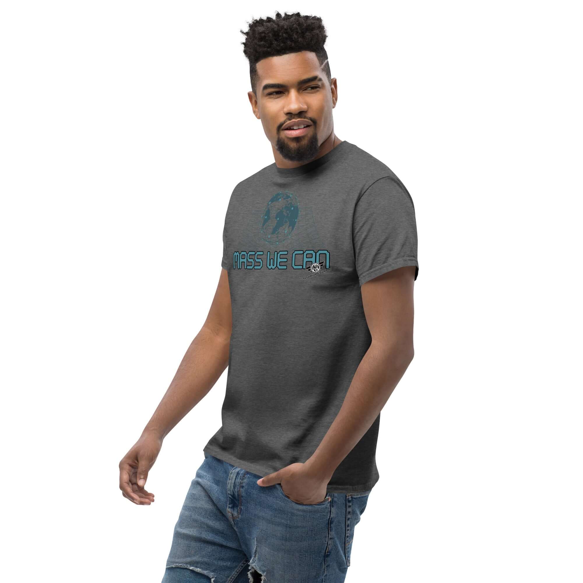 Alt Tag: Man wearing Mass We Can t-shirt with space-time curvature design, showcasing gravitational relativity humor in gray.