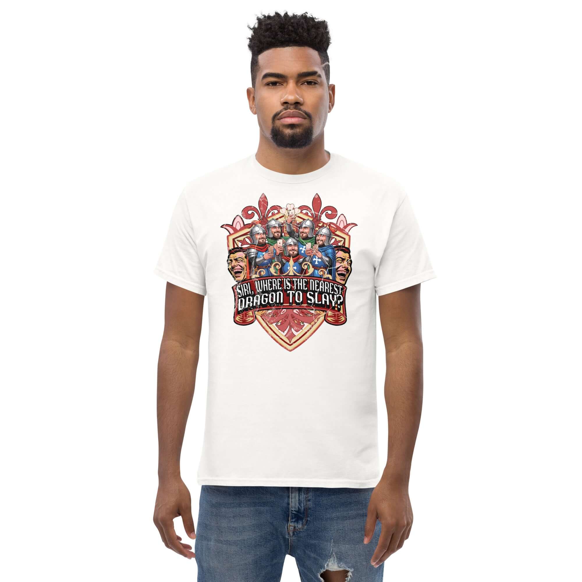 Man wearing a white t-shirt with a medieval heraldic design featuring knights holding smartphones and the text 'SIRI, WHERE IS THE NEAREST DRAGON TO SLAY?'