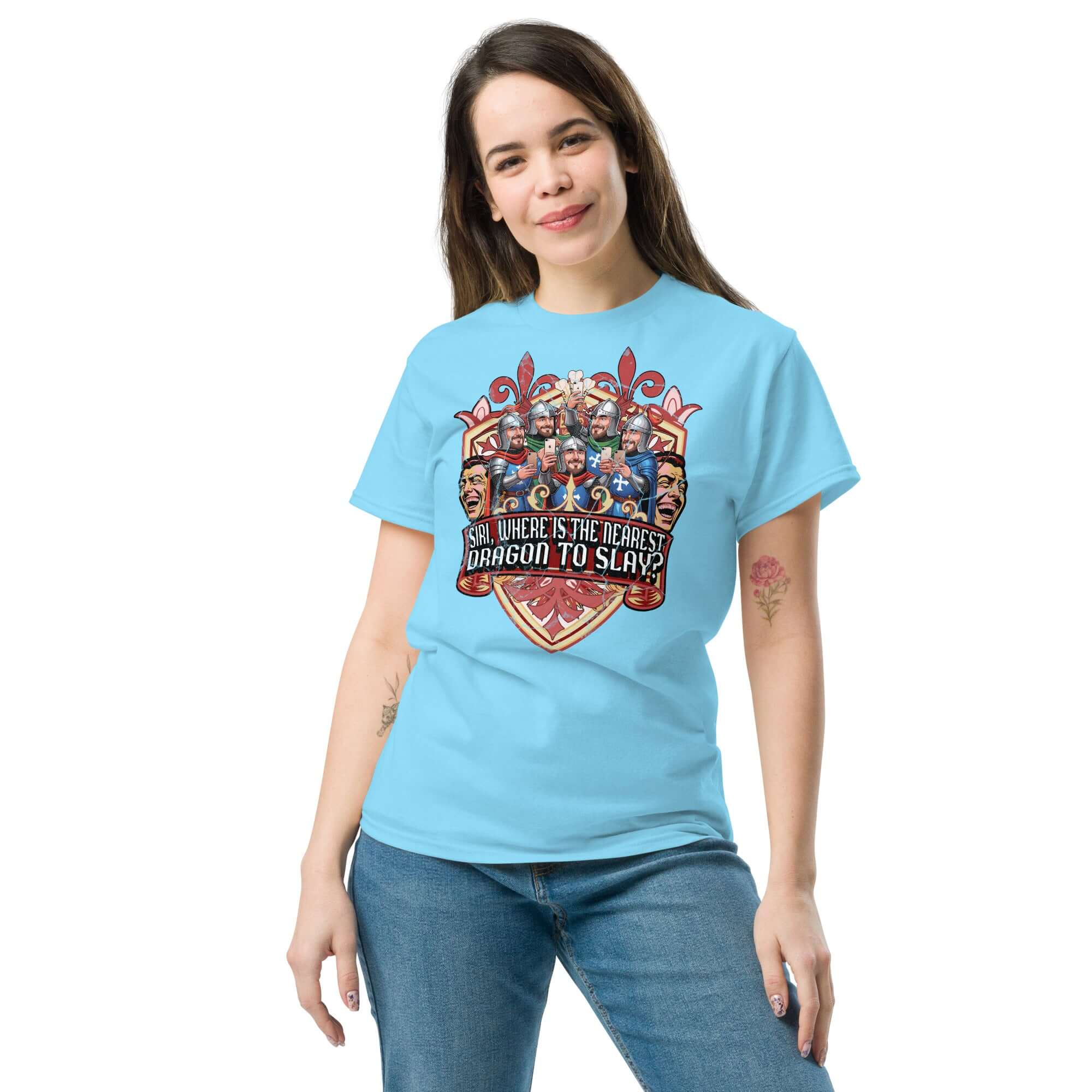 Medieval iPhone T-Shirt featuring knights with smartphones and 'SIRI, WHERE IS THE NEAREST DRAGON TO SLAY?' text, worn by a woman.