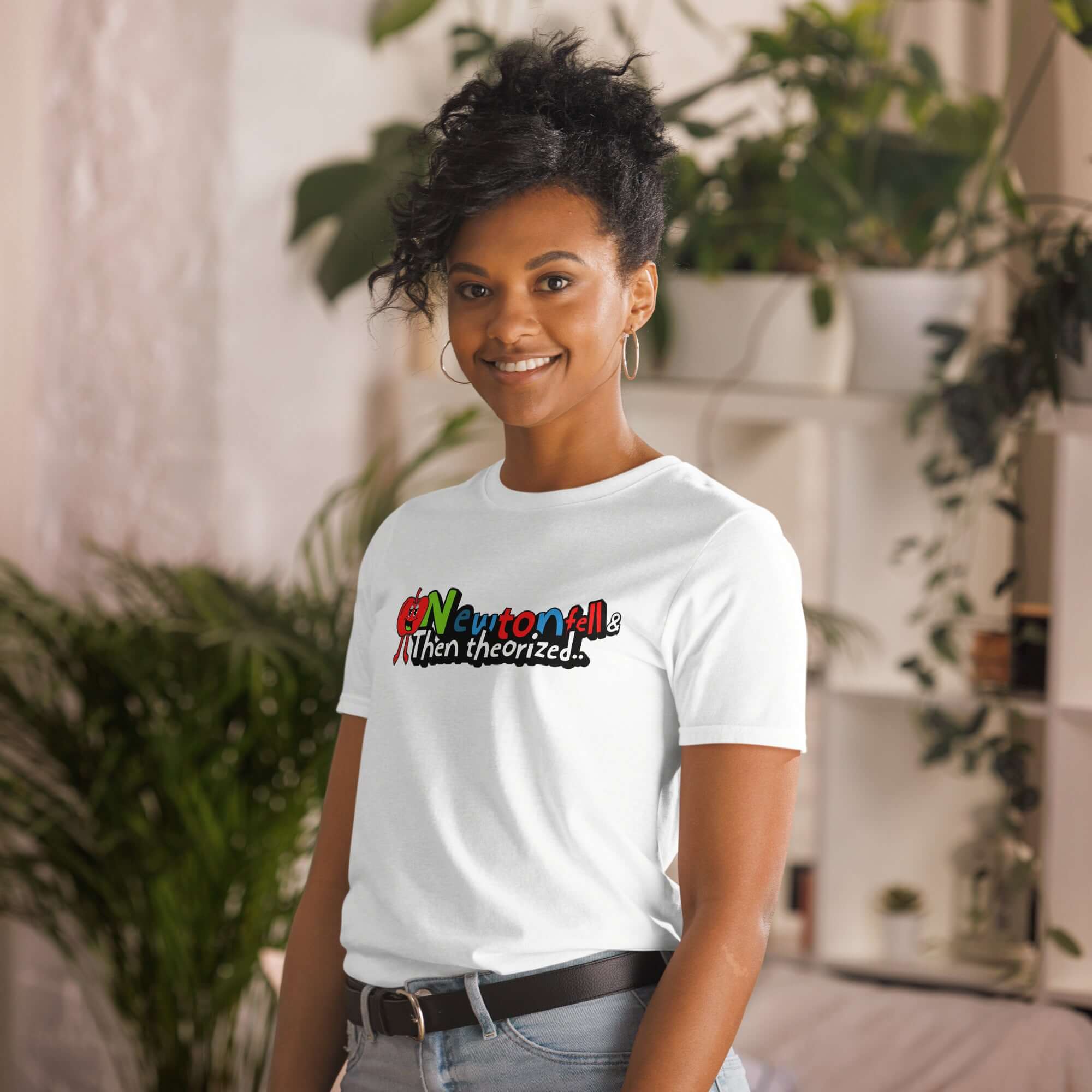 Woman wearing "Newton Fell & Then Theorized" t-shirt with physics humor design, featuring a cartoon apple character.