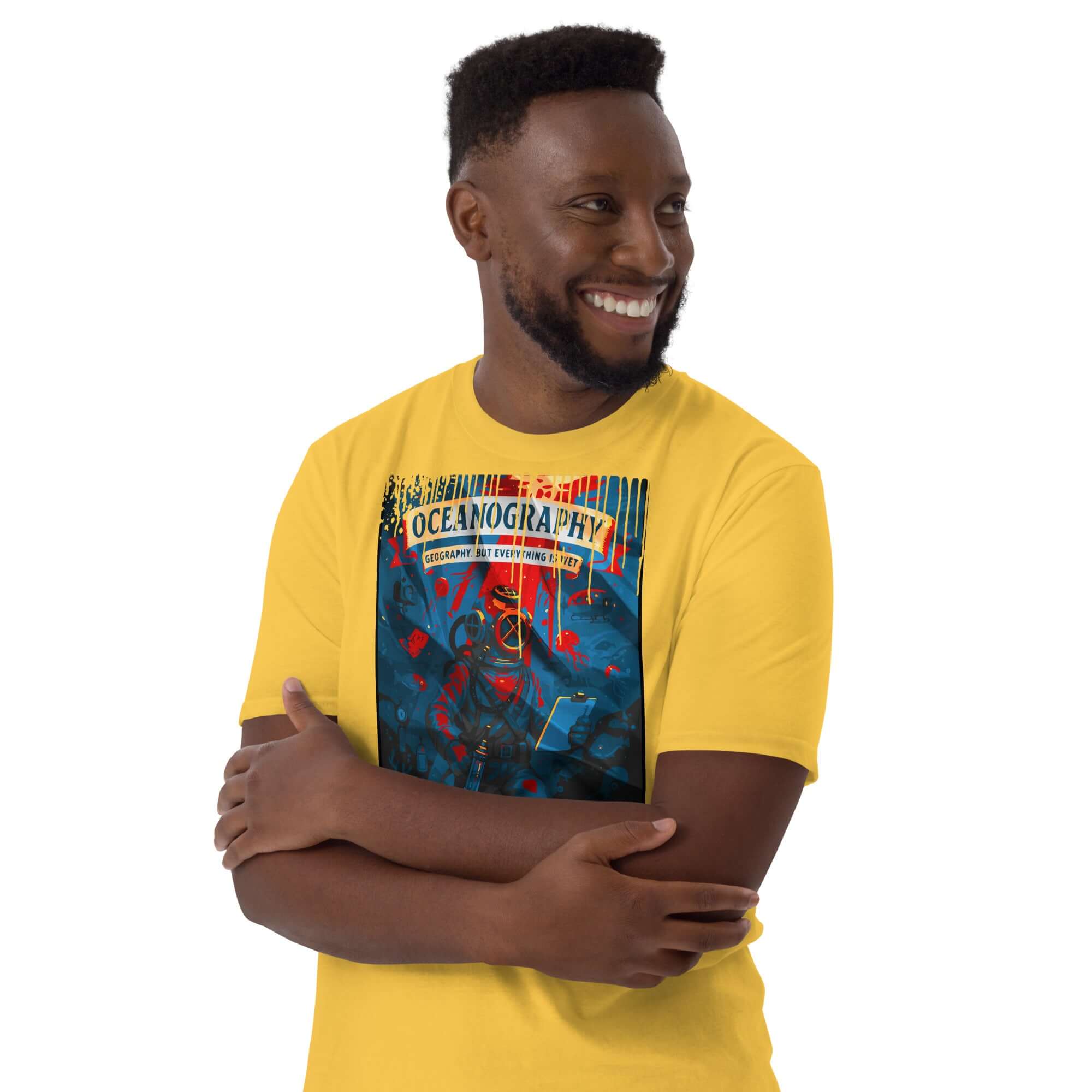 Man wearing a yellow Oceanography T-shirt featuring a vintage diving poster design with marine science theme.
