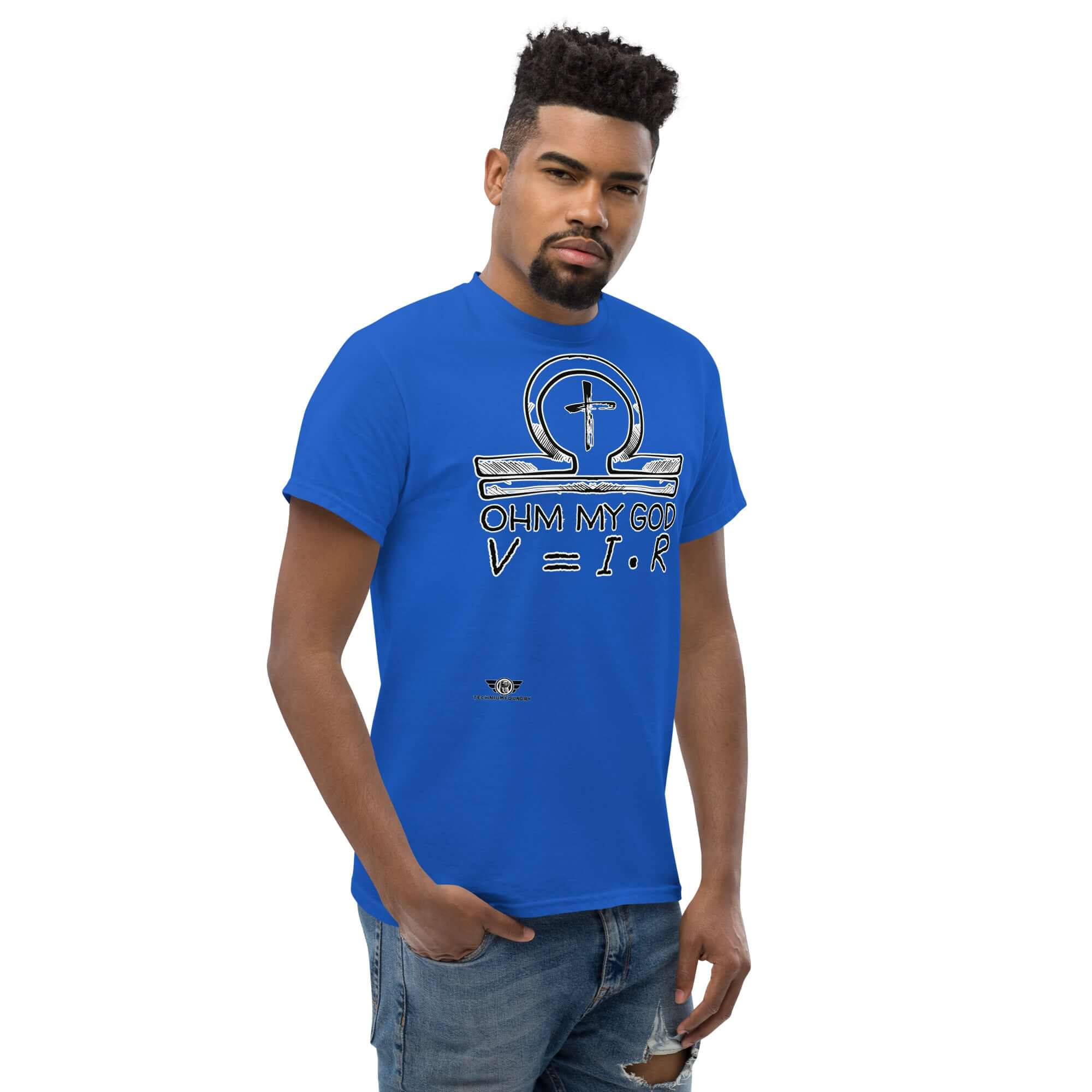 Man wearing blue "Ohm My God" t-shirt featuring omega symbol in religious humor design with Ohm's Law equation, blending physics and faith.