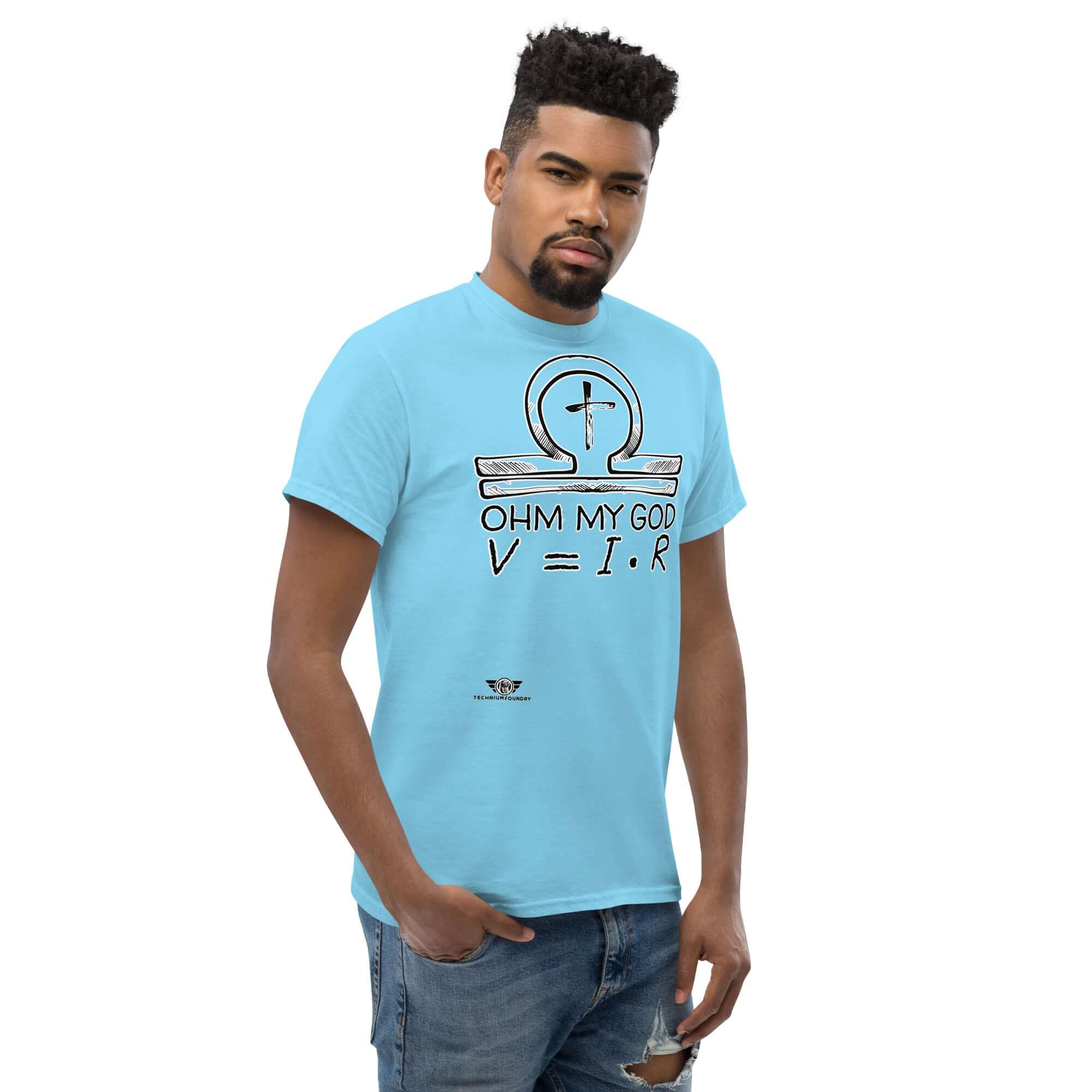Man wearing "Ohm My God" t-shirt with omega symbol and Ohm's Law equation, blending physics and faith in humorous style.