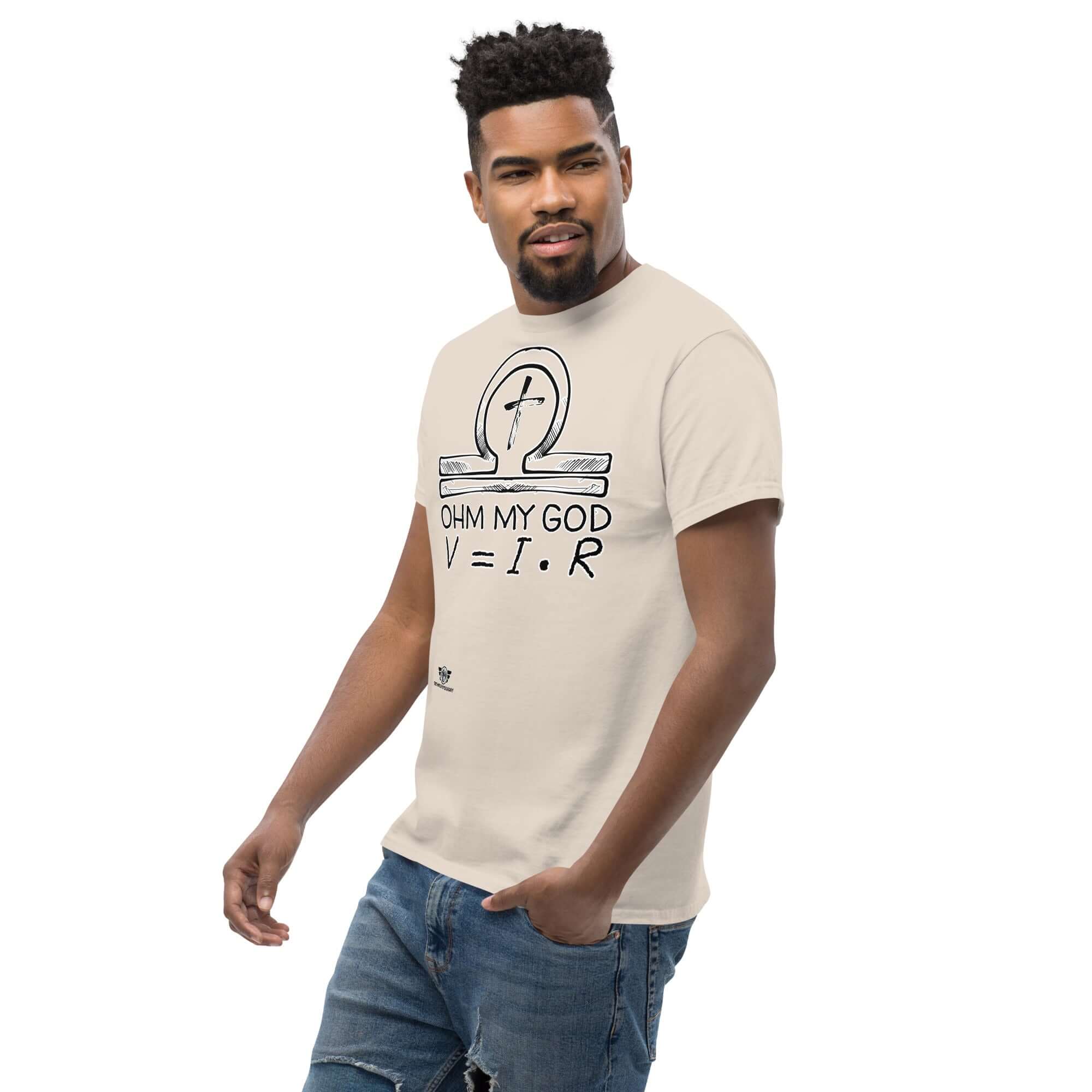 Man wearing 'Ohm My God' T-shirt featuring Ohm's Law with religious humor, illustrated with an ankh-omega symbol in chalkboard style.