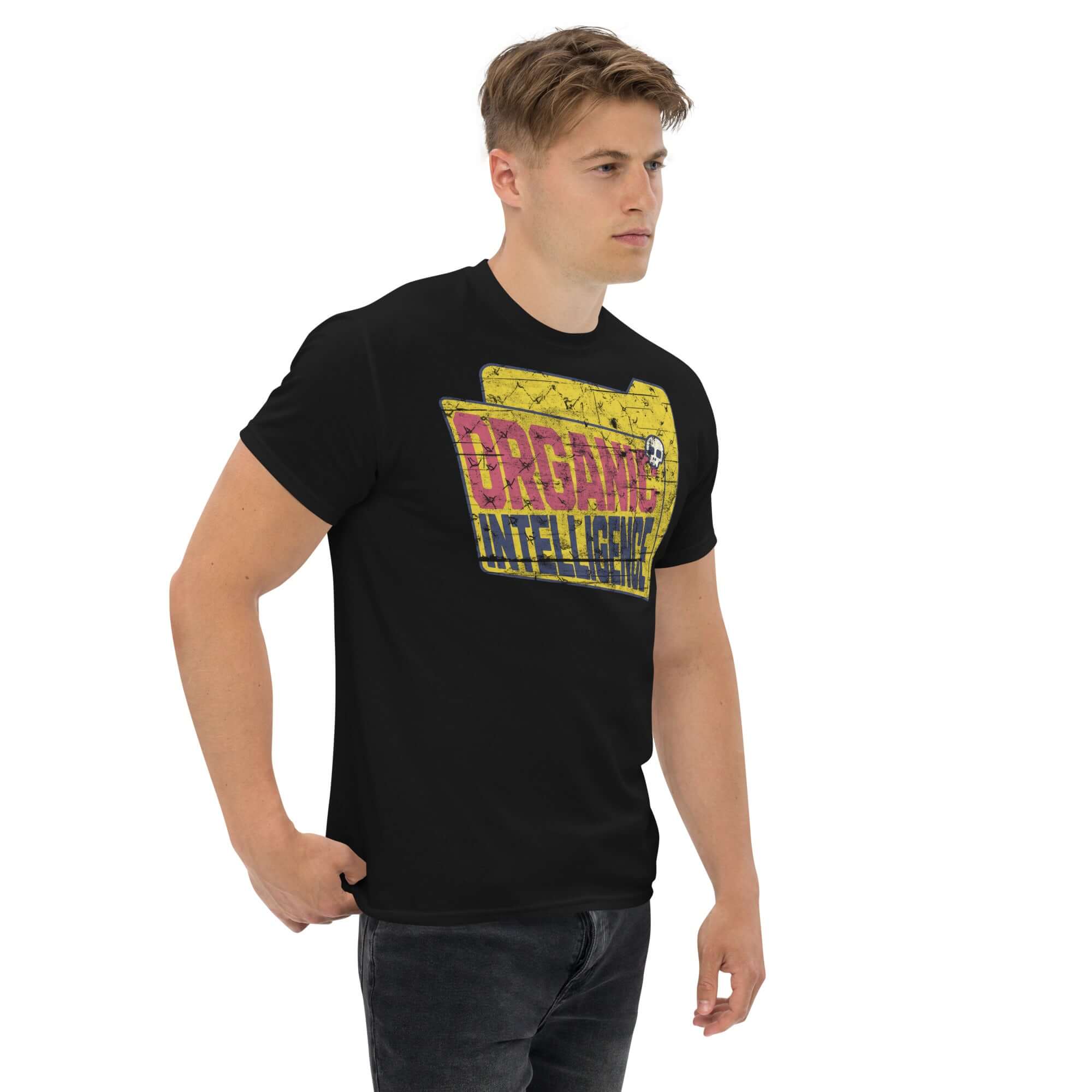 Man wearing black 'Organic Intelligence' t-shirt with vintage folder design, tech rebellion apparel.