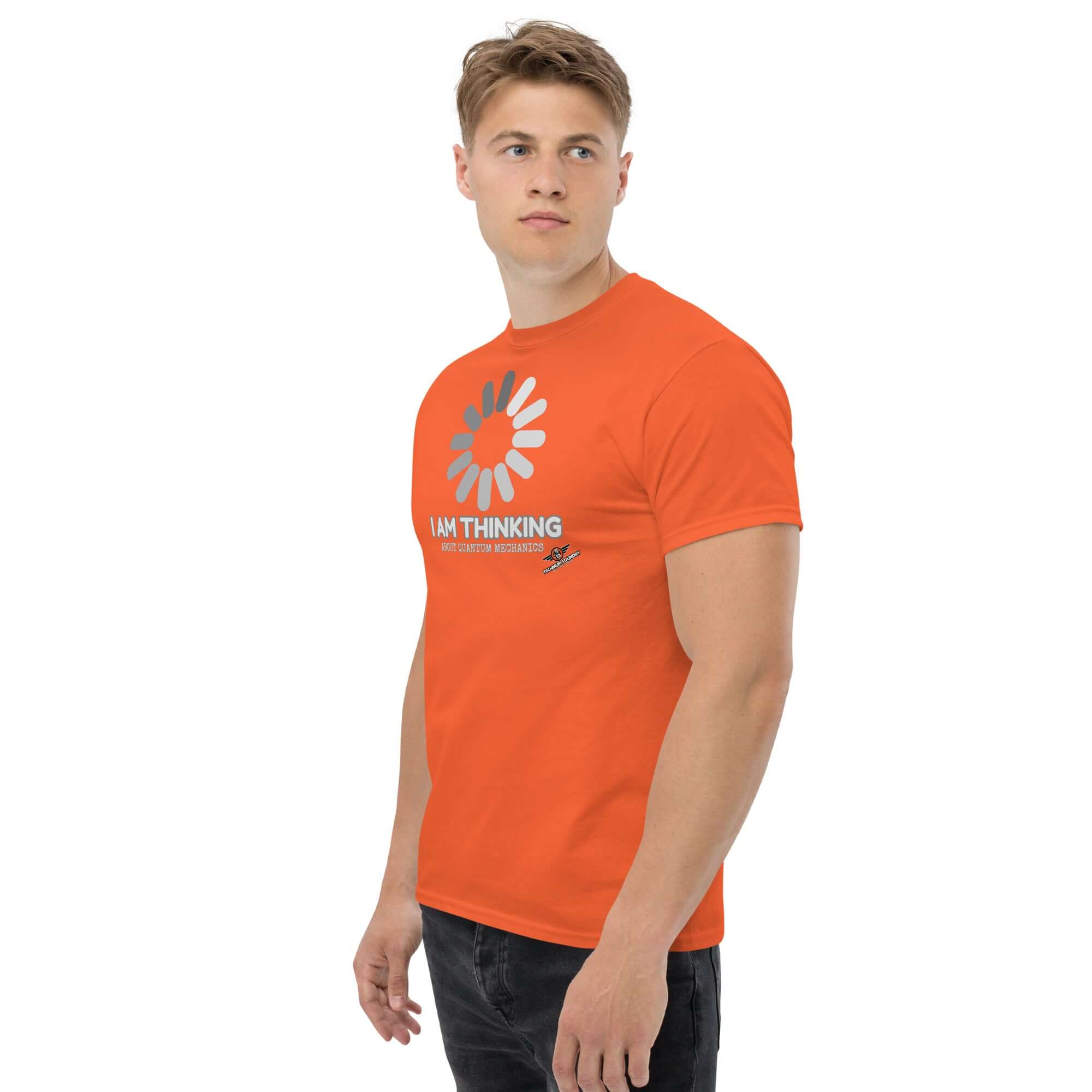 Man wearing orange Schrödinger's Buffer T-shirt labeled "I Am Thinking About Quantum Mechanics," featuring a minimalist loading graphic.