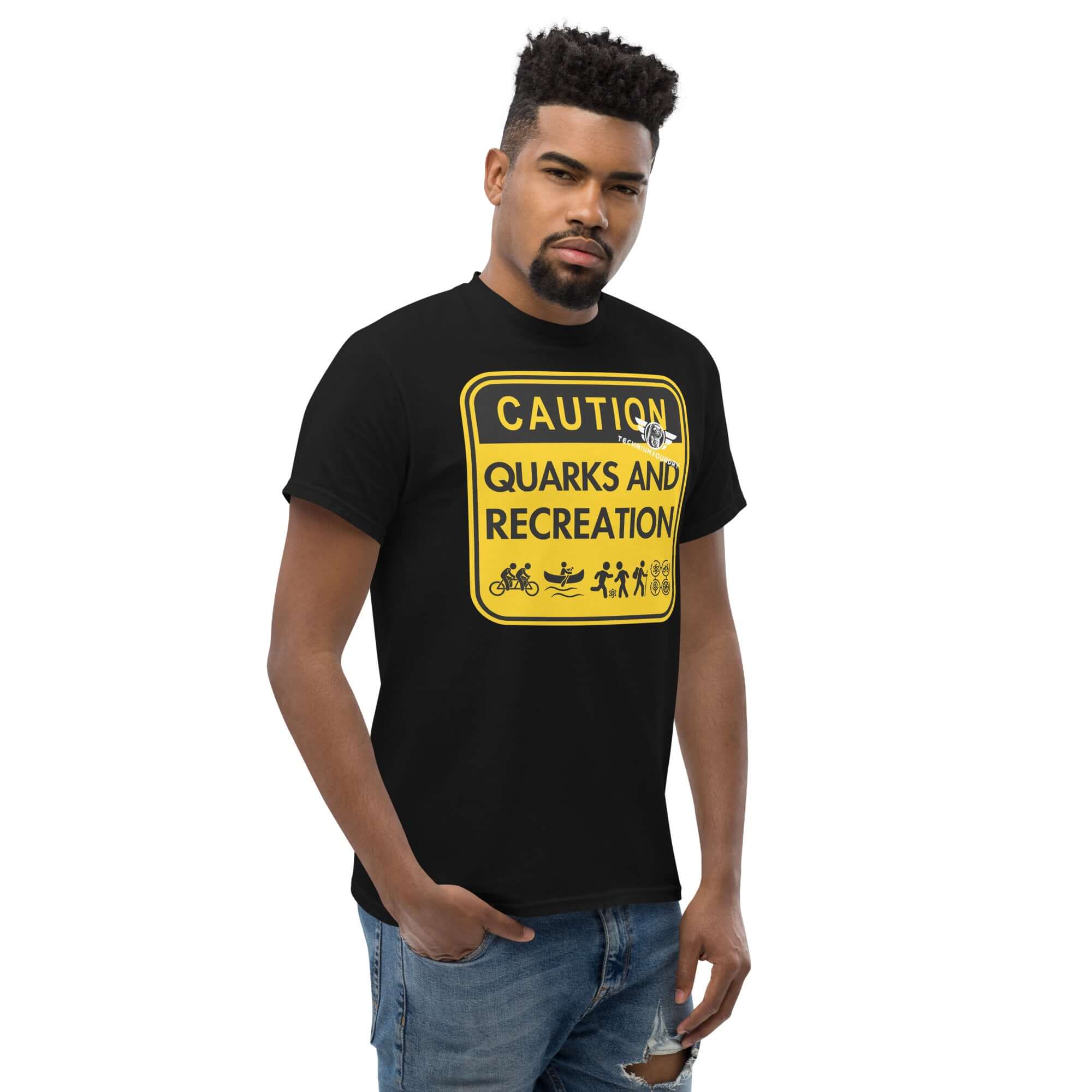 Man wearing 'Quarks and Recreation' humorous particle physics t-shirt with yellow warning sign design.