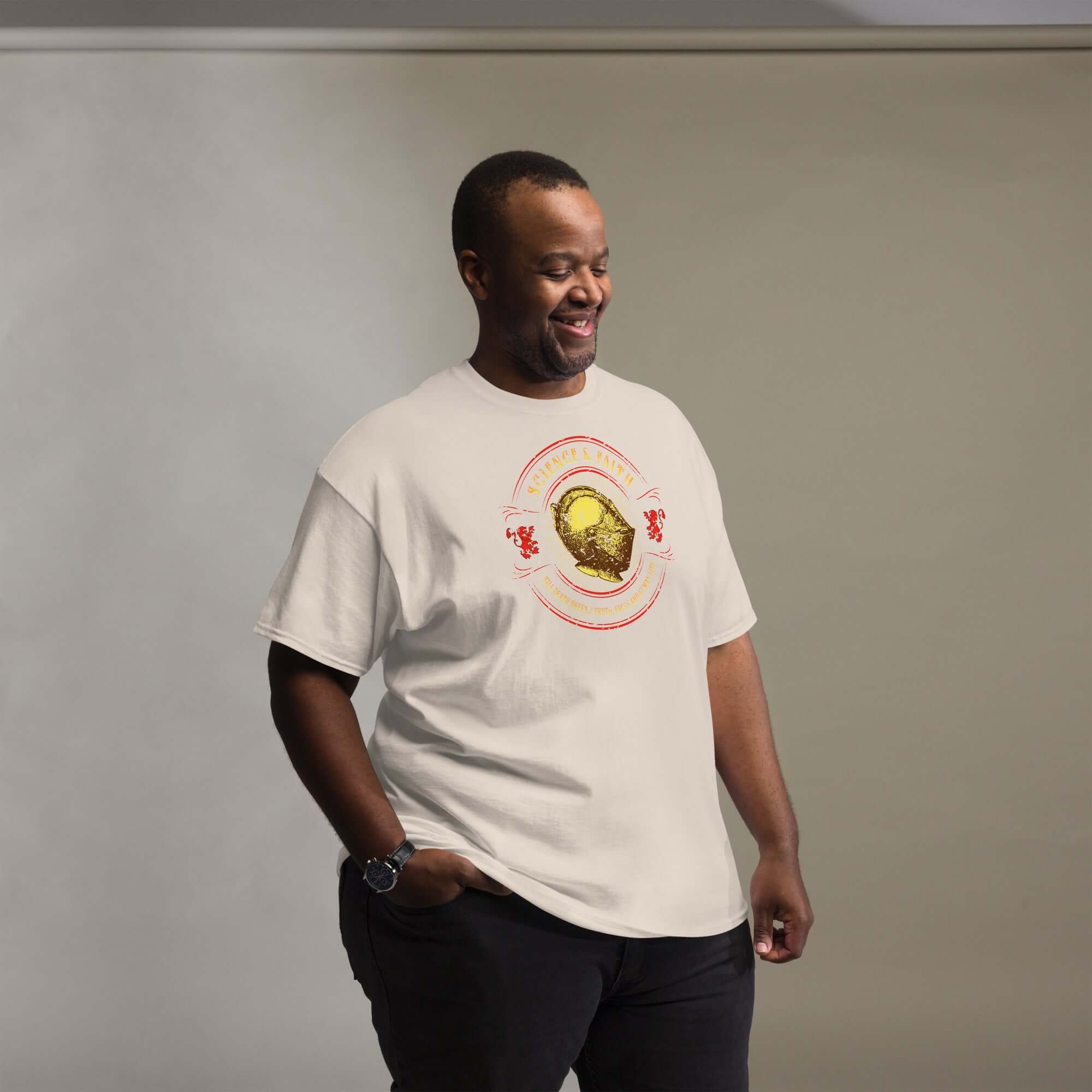 Man wearing Science & Faith Medieval Knight T-Shirt, featuring a knight's helmet design, merging Renaissance Faire style with modern intellect.