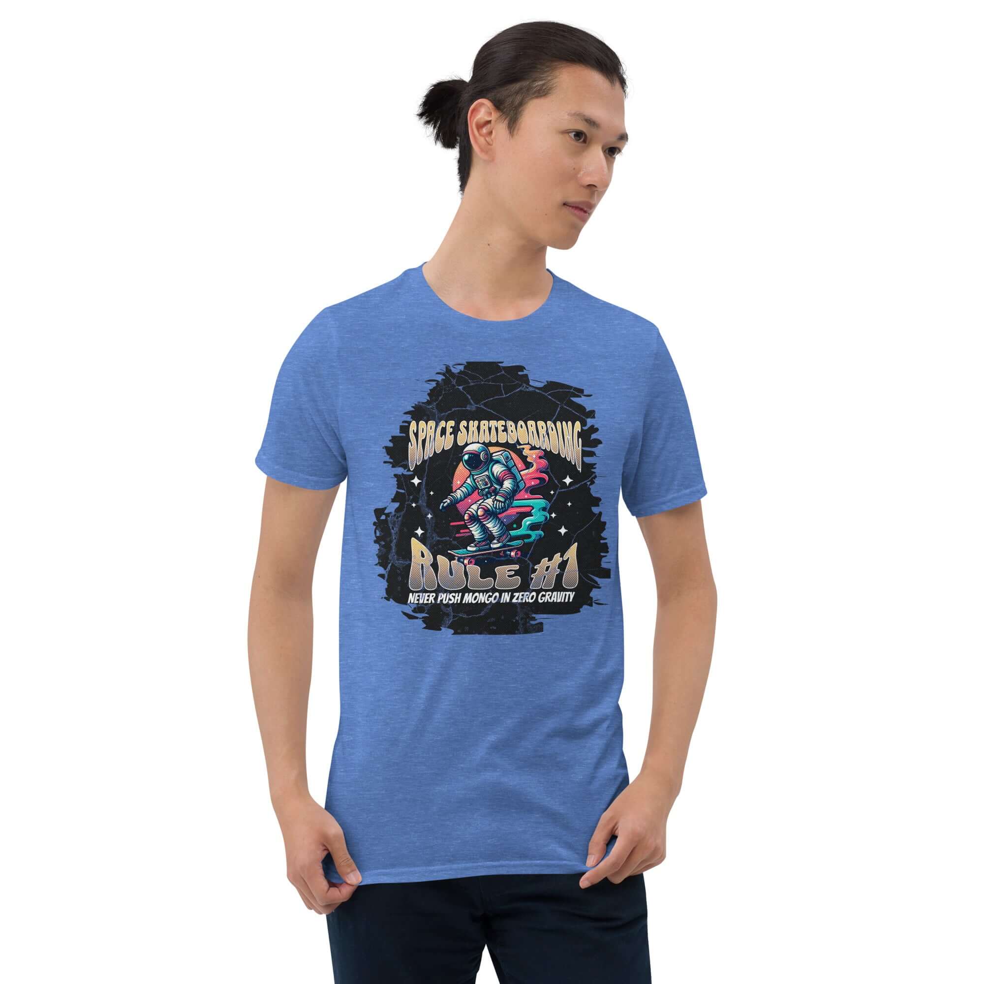 Man wearing "Space Skateboarding Rule #1" t-shirt with astronaut on neon skateboard, blue background.