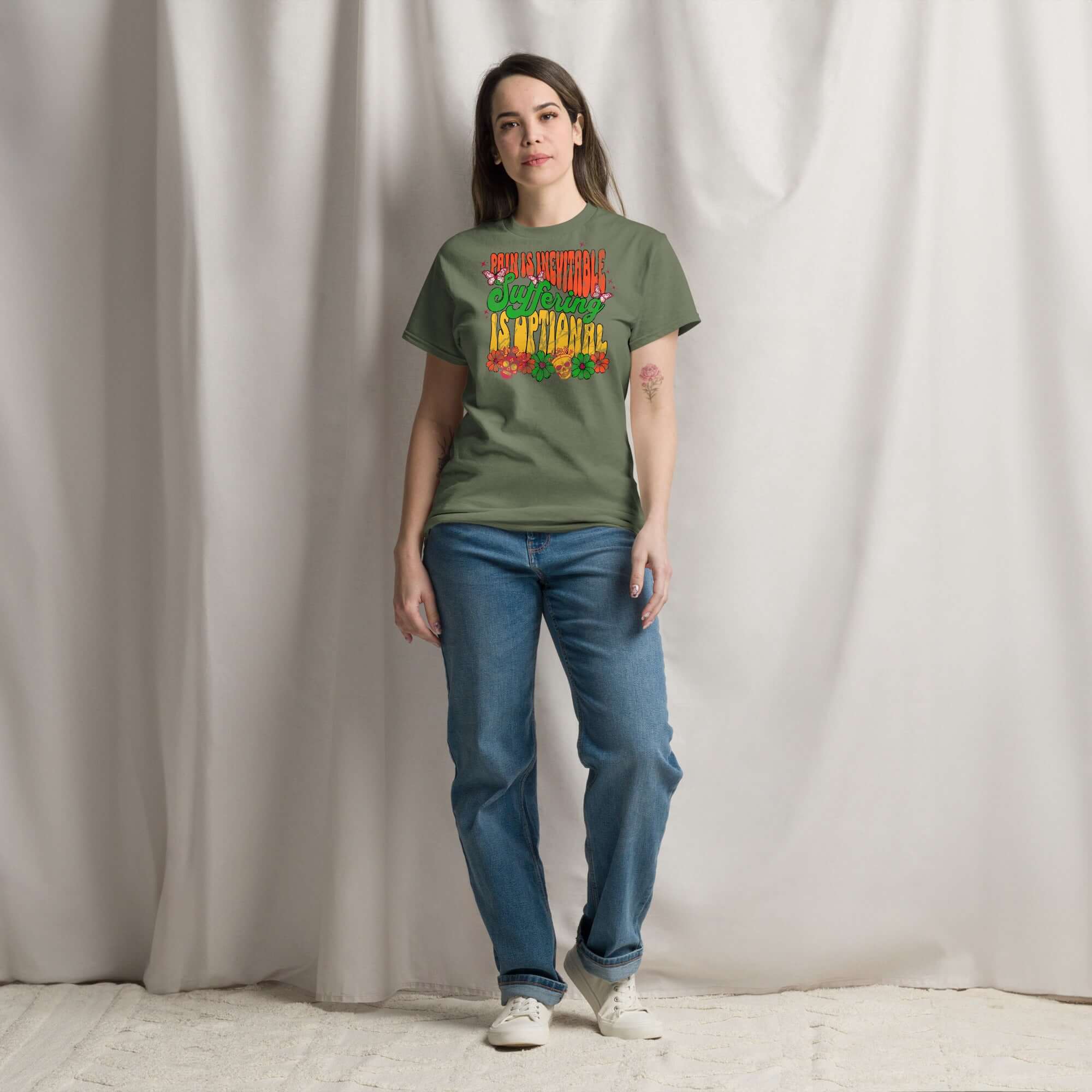 Model wearing Stoic Philosophy Drip T-Shirt with 'Pain Is Inevitable Suffering Is Optional' design in psychedelic colors.
