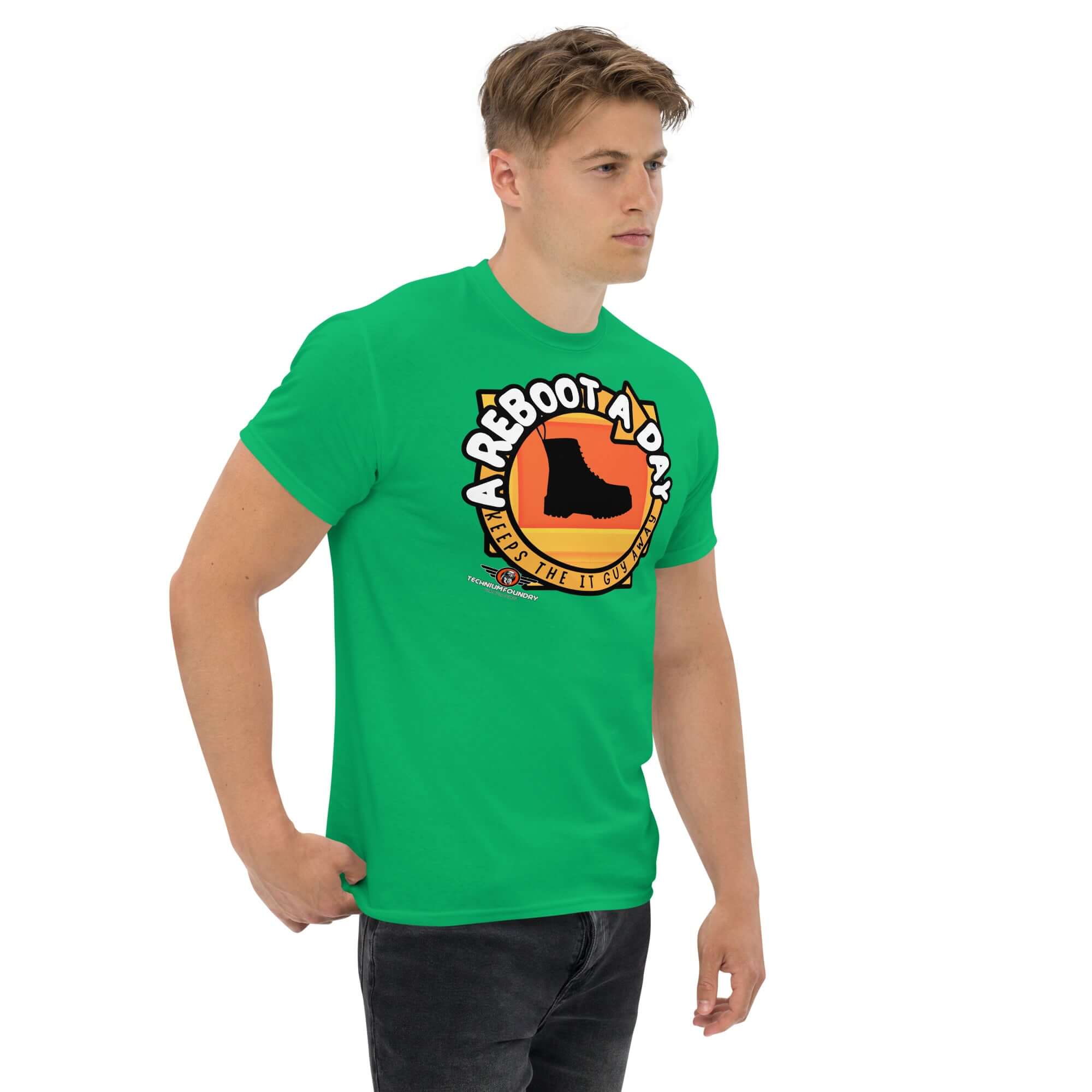 Green t-shirt with 'A Reboot A Day' IT support humor design featuring a boot silhouette and sunset backdrop.
