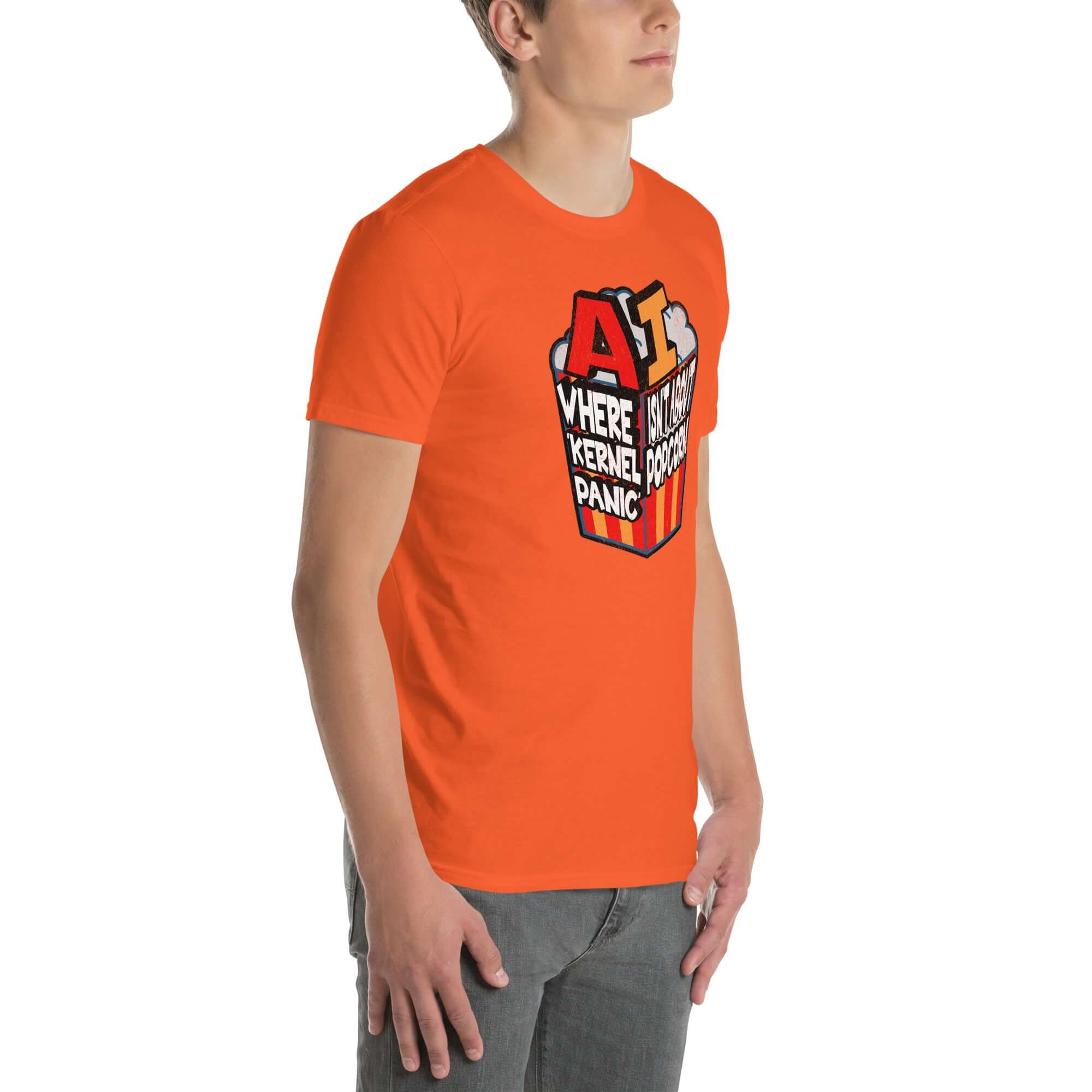 Man wearing orange t-shirt with 'AI: Where Kernel Panic Isn't About Popcorn' computer humor graphic.