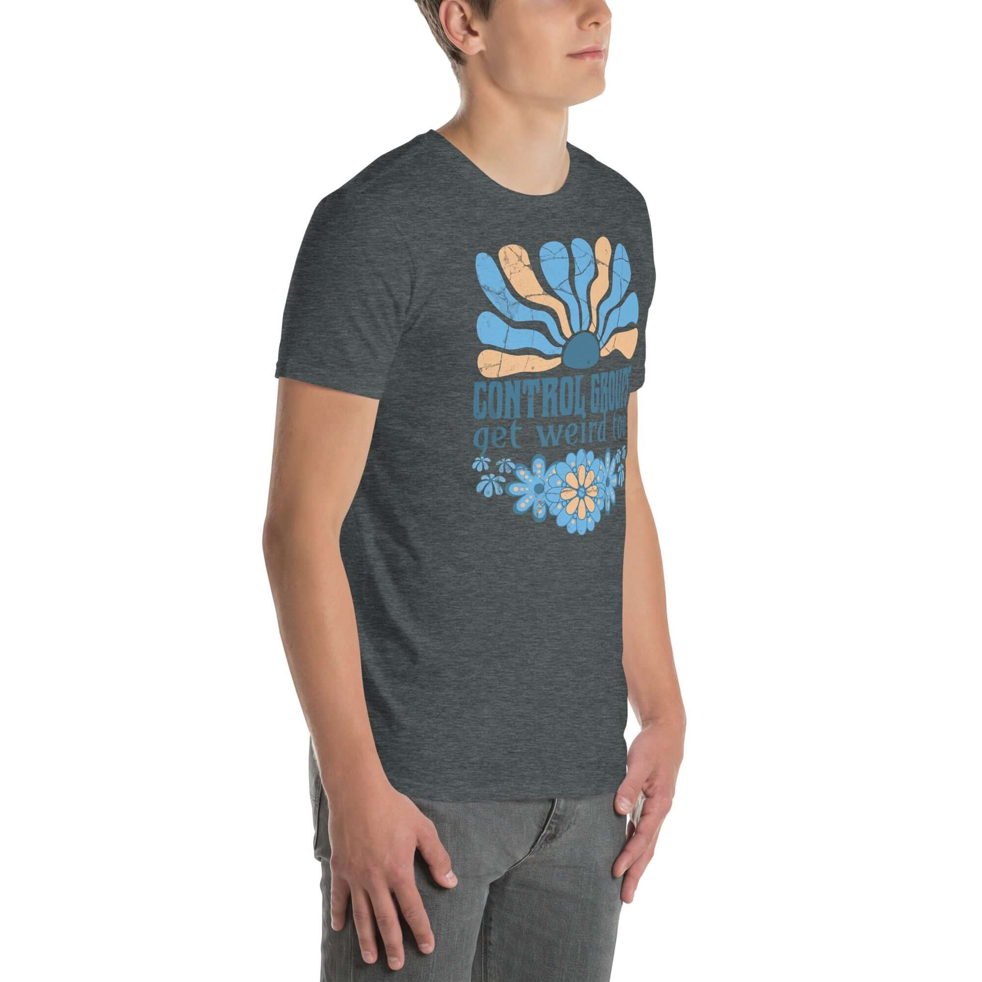 Person wearing a "Control Groups Get Weird Too" retro science t-shirt with a 70s-inspired blue and orange sunburst design.