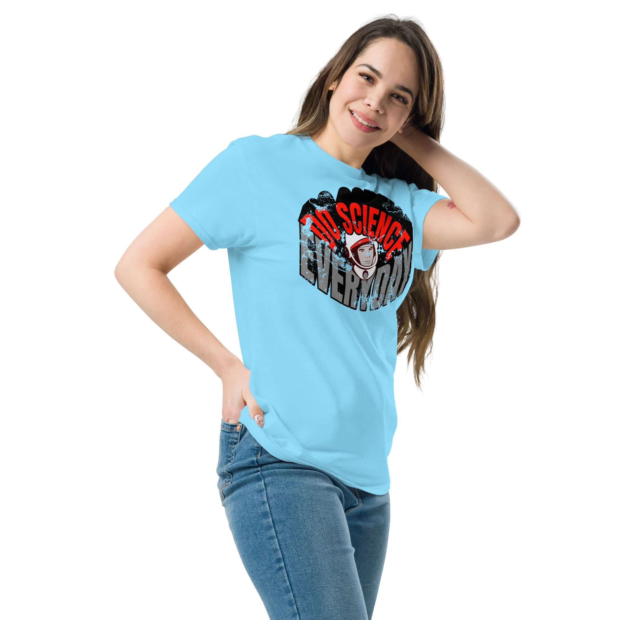 Woman wearing a blue Do Science Every Day T-Shirt featuring a retro astronaut design, combining space and fashion exploration.