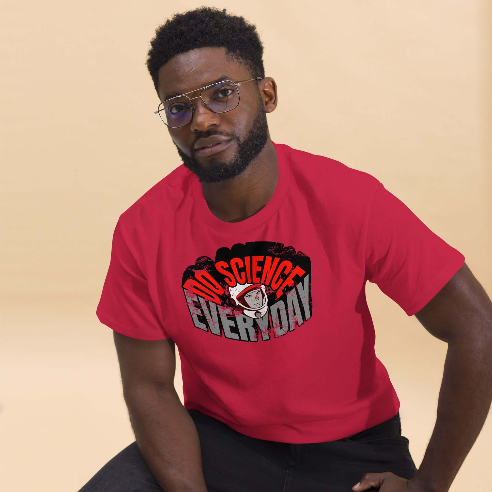 Man wearing 'Do Science Every Day' t-shirt with astronaut graphic, showcasing a blend of fashion and scientific exploration.