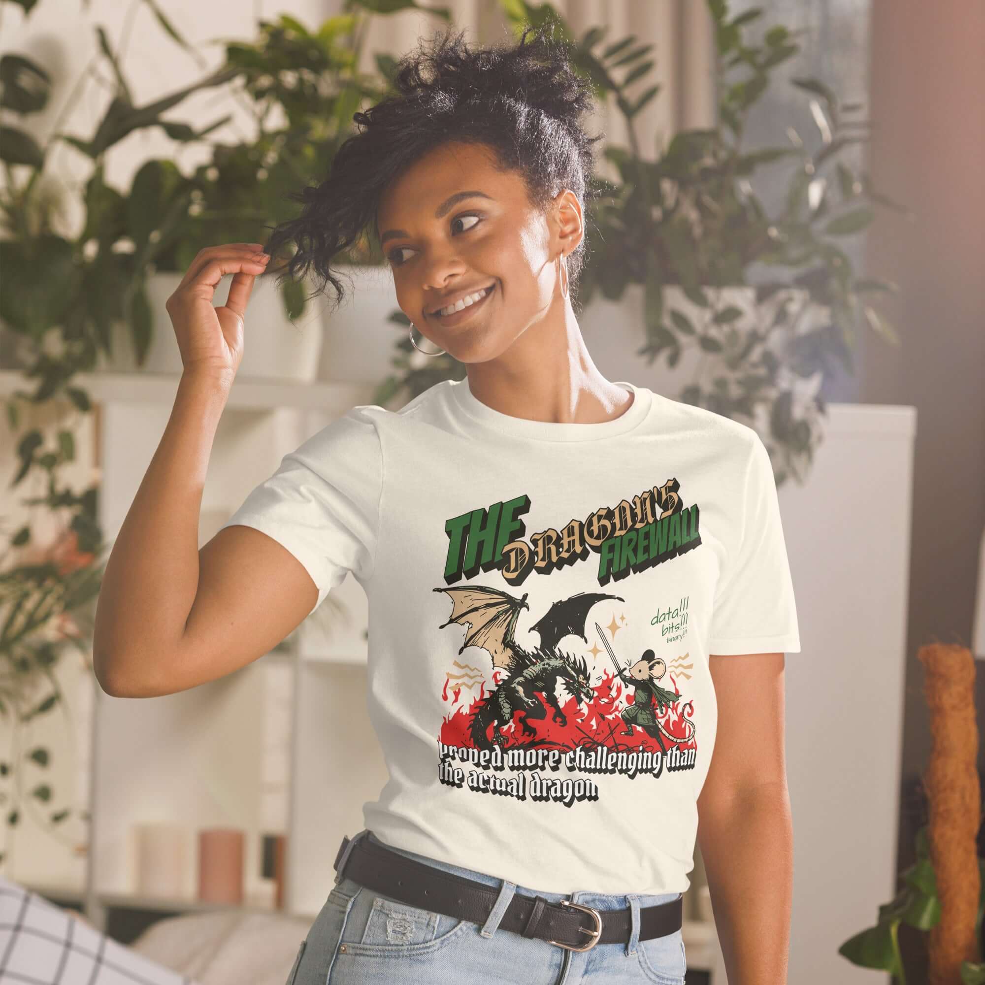 Woman wearing "The Dragon Firewall" T-shirt featuring a mouse warrior and dragon in a humorous network security design.