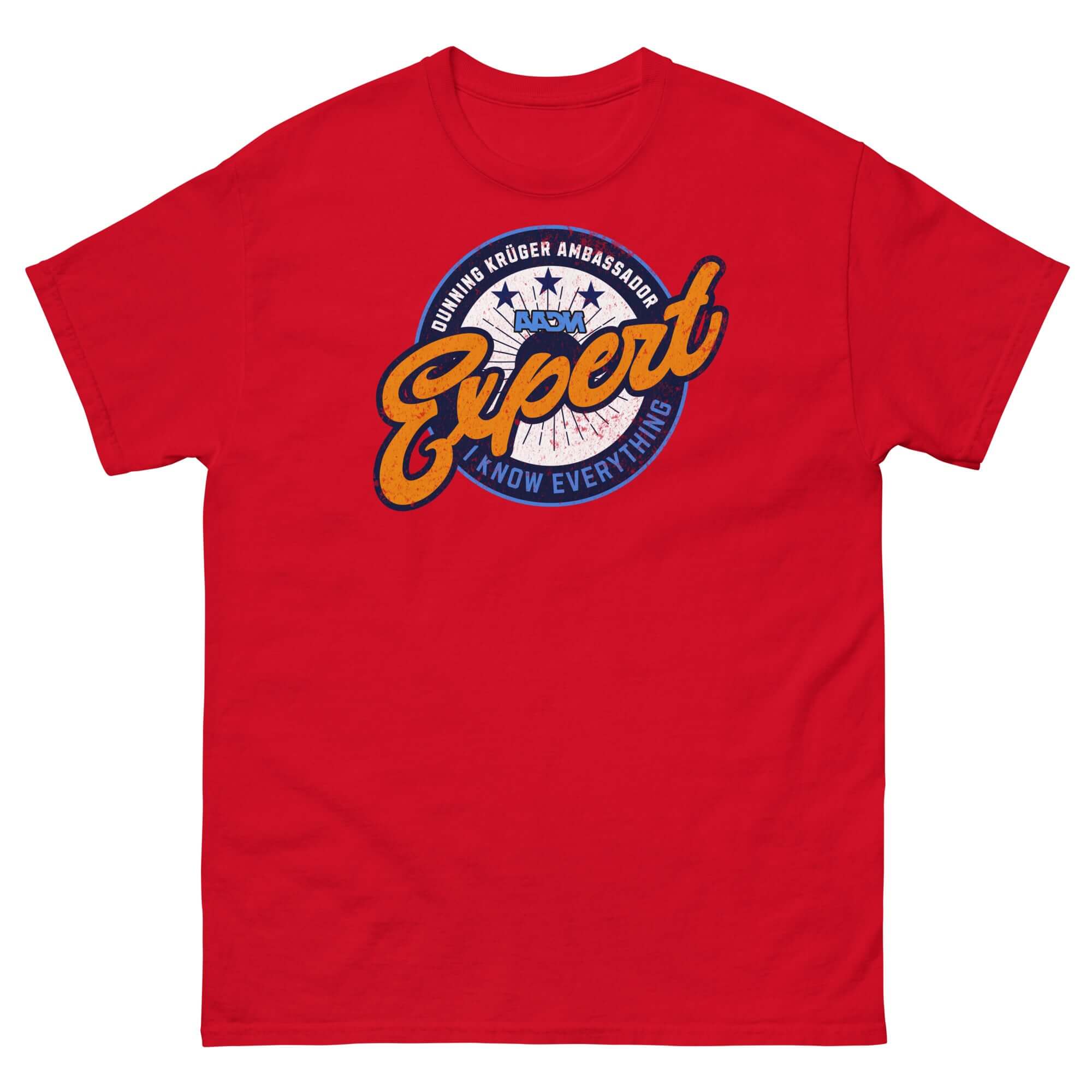 Red t-shirt featuring Dunning-Kruger Expert logo, playful psychology design, and circular emblem resembling sports team badge.