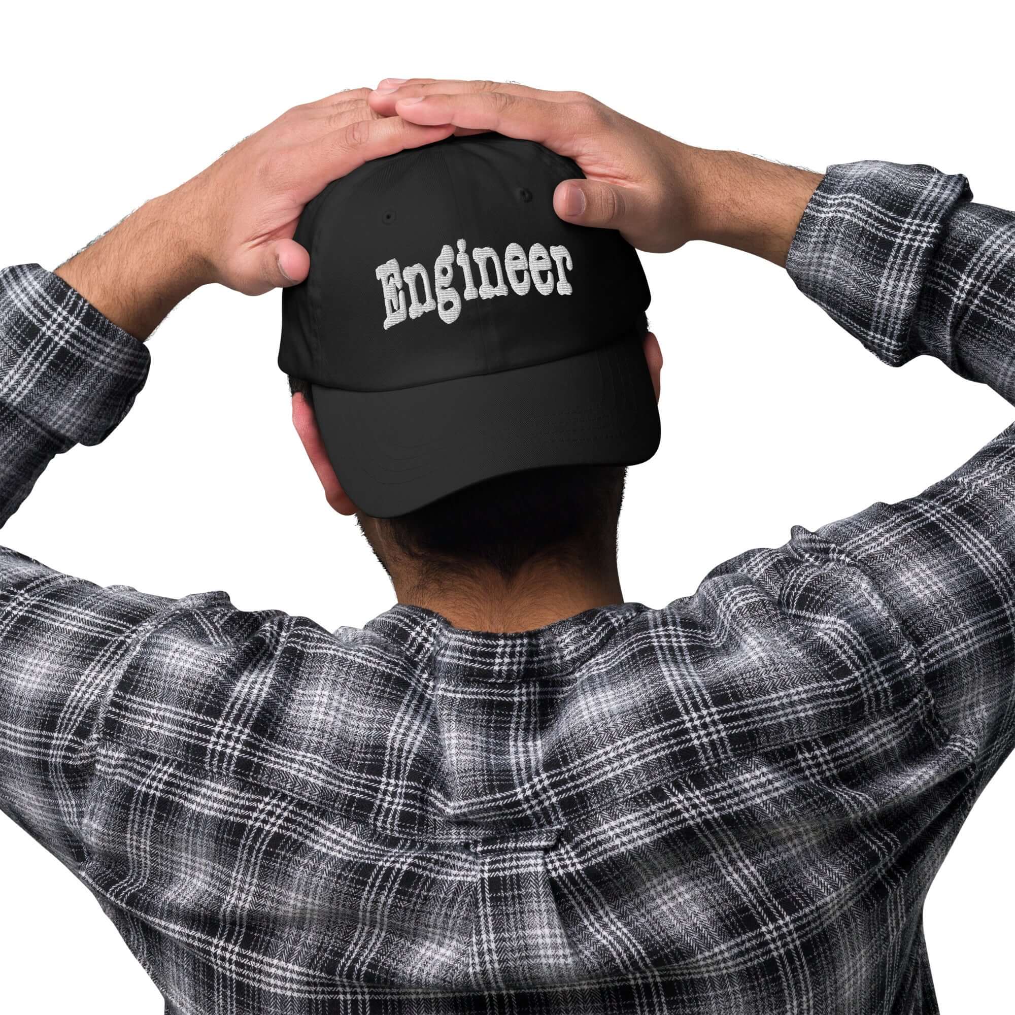 Man wearing 'Engineer' baseball cap, embodying professional problem-solving and optimal style. Perfect headwear for engineers.