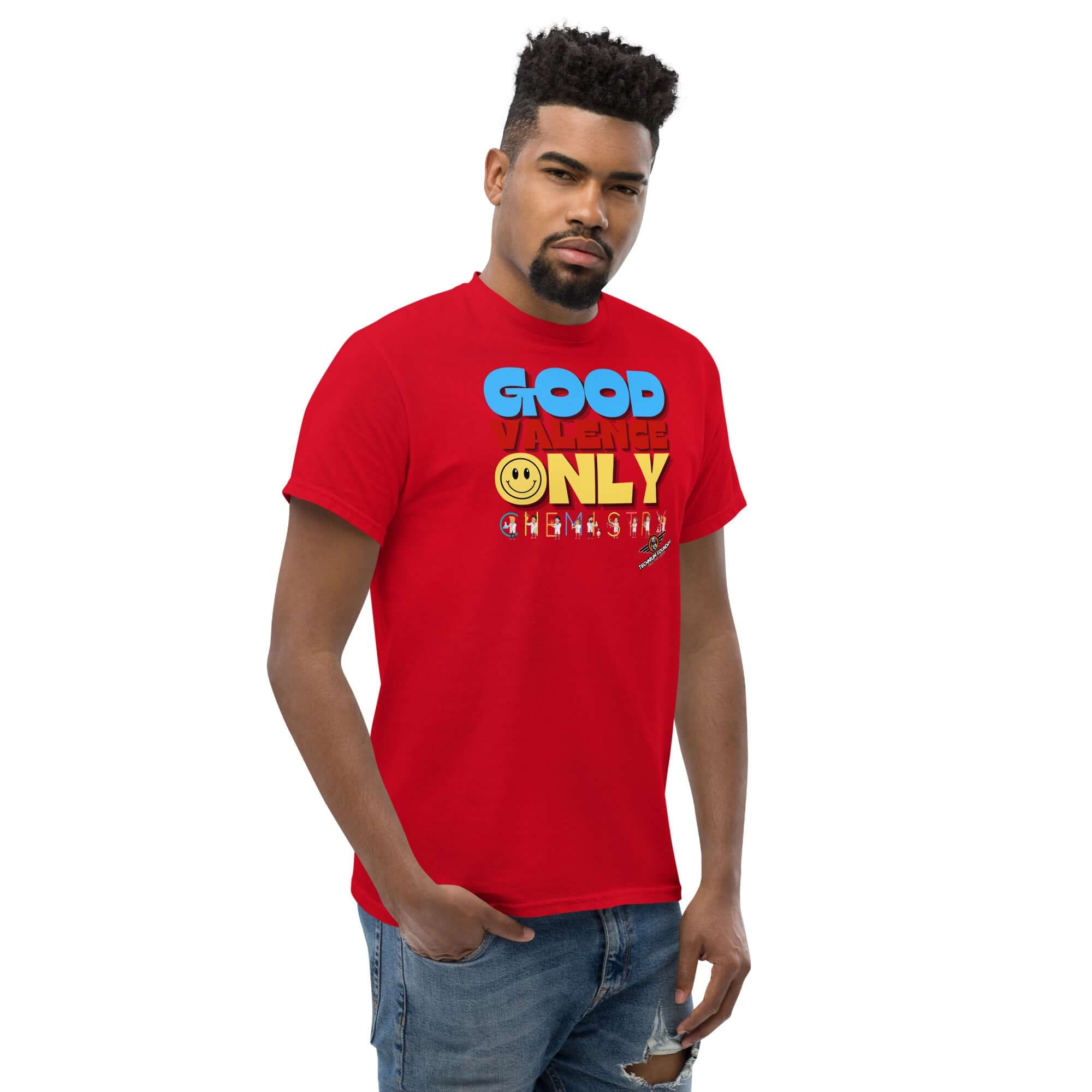 Man wearing a red "Good Valence Only" chemistry t-shirt with blue, yellow, and smiley typography, inspired by scientific humor.