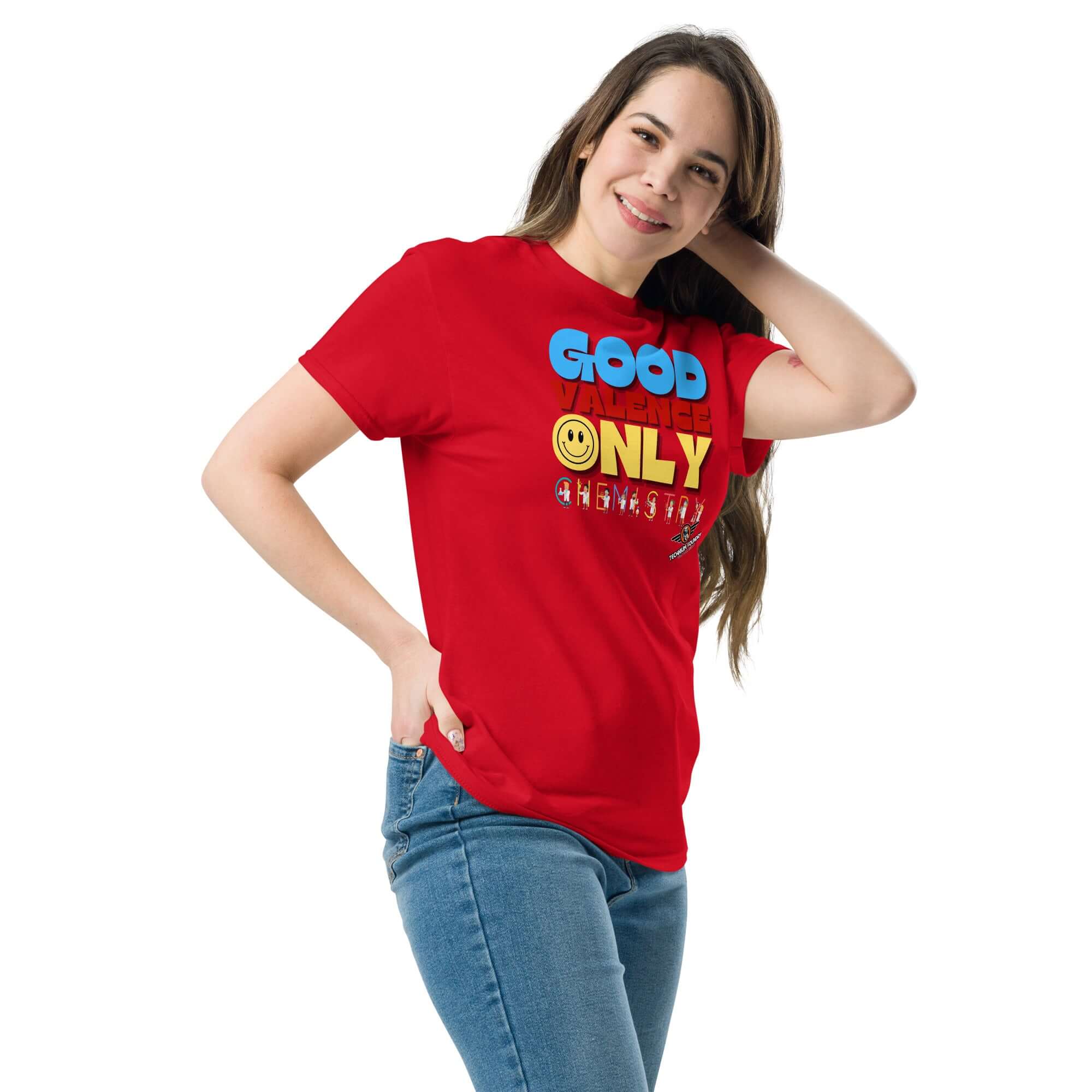 Woman in red "Good Valence Only" chemistry t-shirt, featuring cheerful scientist design, promoting scientific humor and positivity.