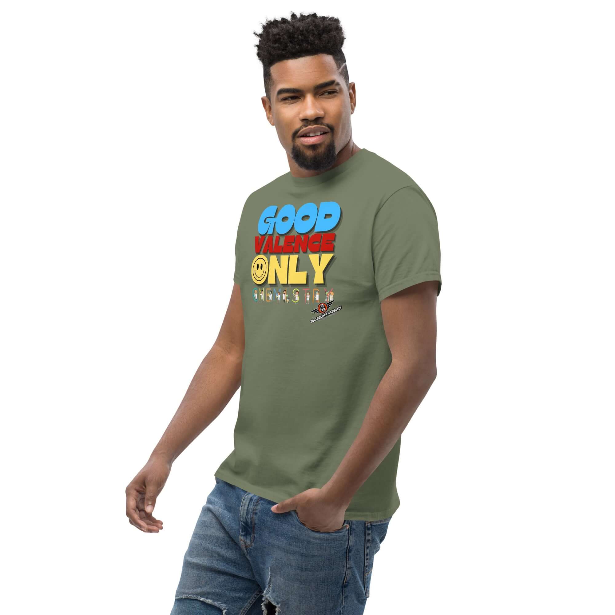 Alt Tag: Man wearing green 'Good Valence Only' chemistry t-shirt with colorful typography and cute scientist characters.