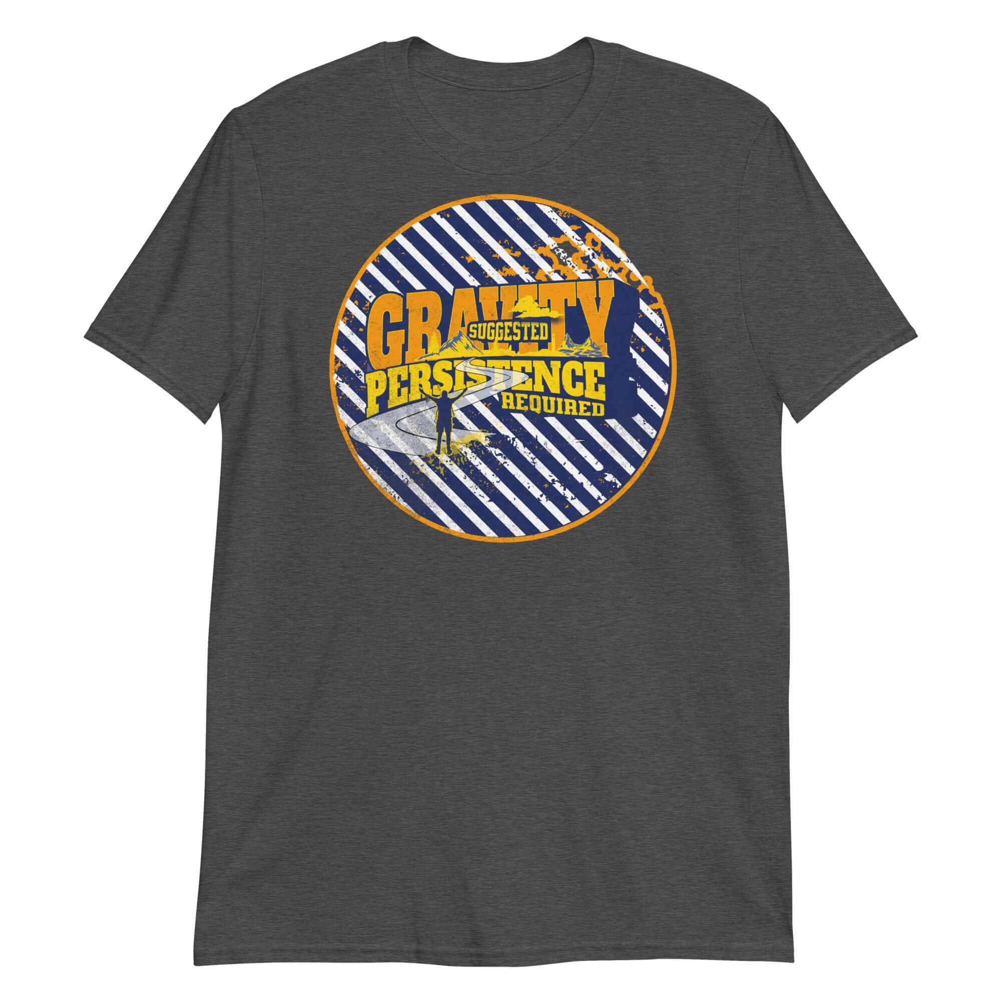 Dark gray t-shirt featuring a motivational slogan "Gravity: Suggested. Persistence: Required" with a dynamic circular emblem design.