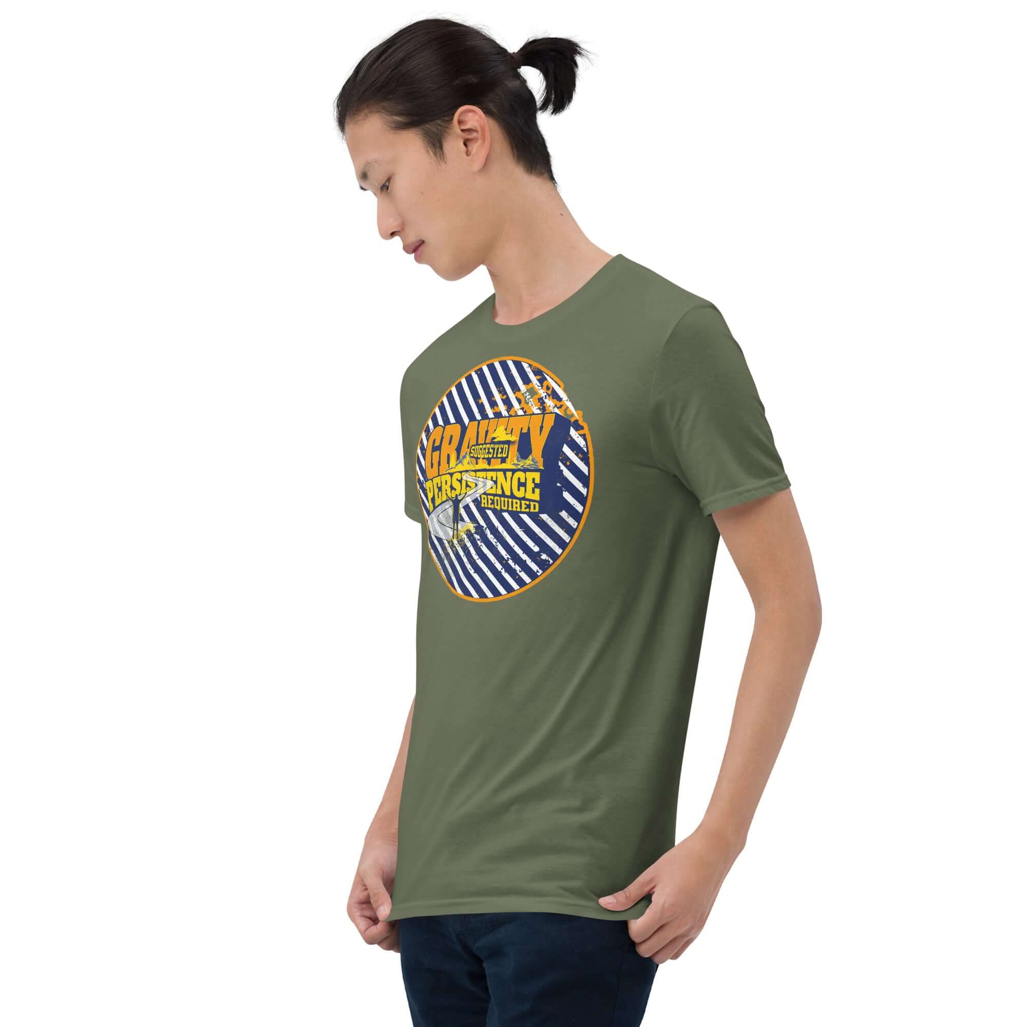 Person wearing 'Gravity: Suggested. Persistence: Required.' motivational t-shirt with blue stripes and yellow text on olive green fabric.