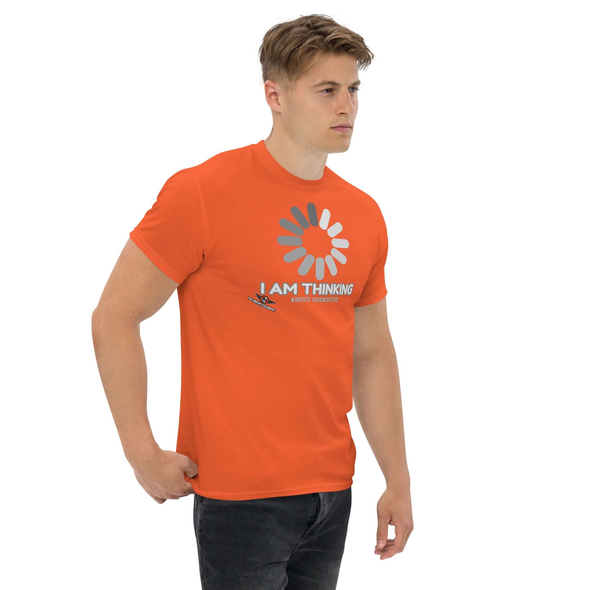 Man wearing orange 'I Am Thinking About Chemistry' t-shirt with a loading screen graphic, symbolizing processing chemical reactions.