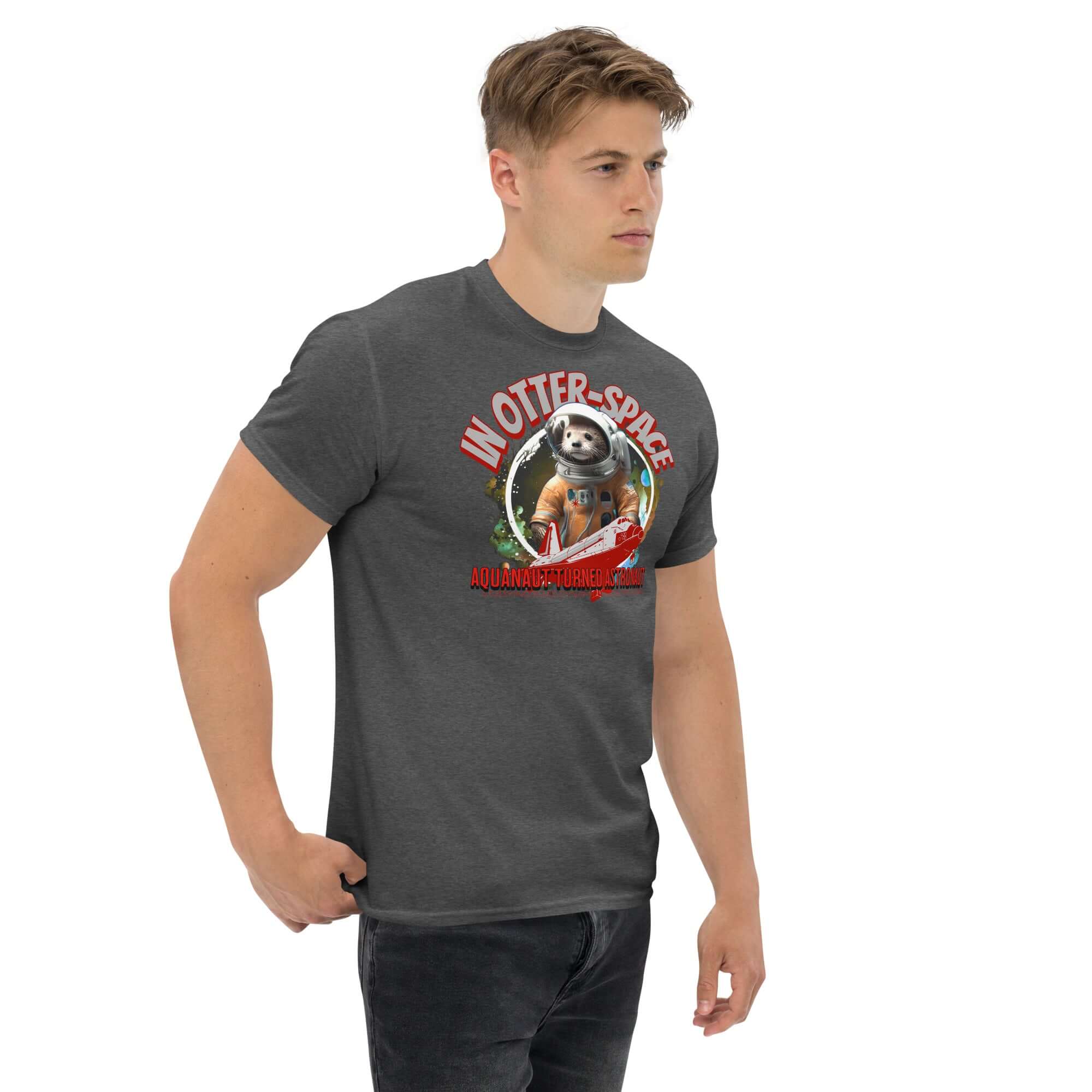 "In Otter Space" t-shirt with otter astronaut design on model, featuring text "Aquanaut Turned Astronaut" and cosmic background.