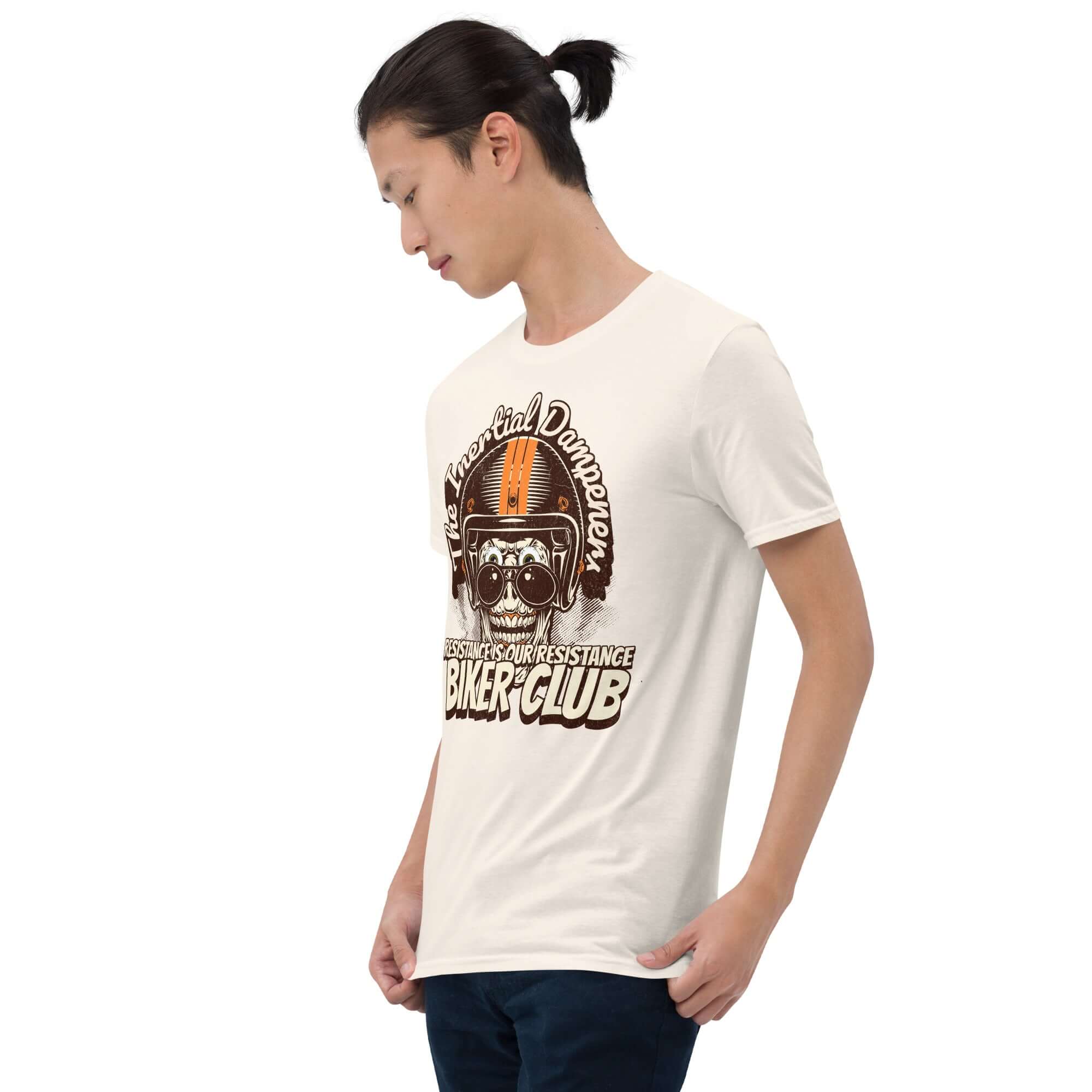 Model wearing 'The Inertial Dampeners' Biker Club T-shirt with helmet-skull design, humor in physics resistance theme.