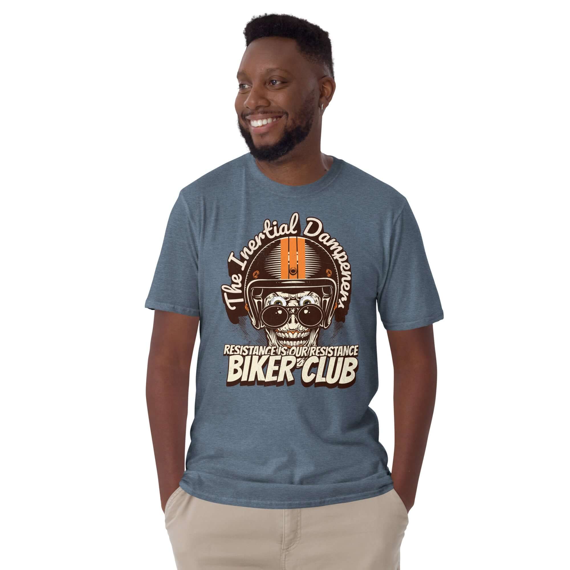 Man wearing a blue 'The Inertial Dampeners Biker Club' t-shirt with a helmet-wearing skull design emphasizing physics humor.