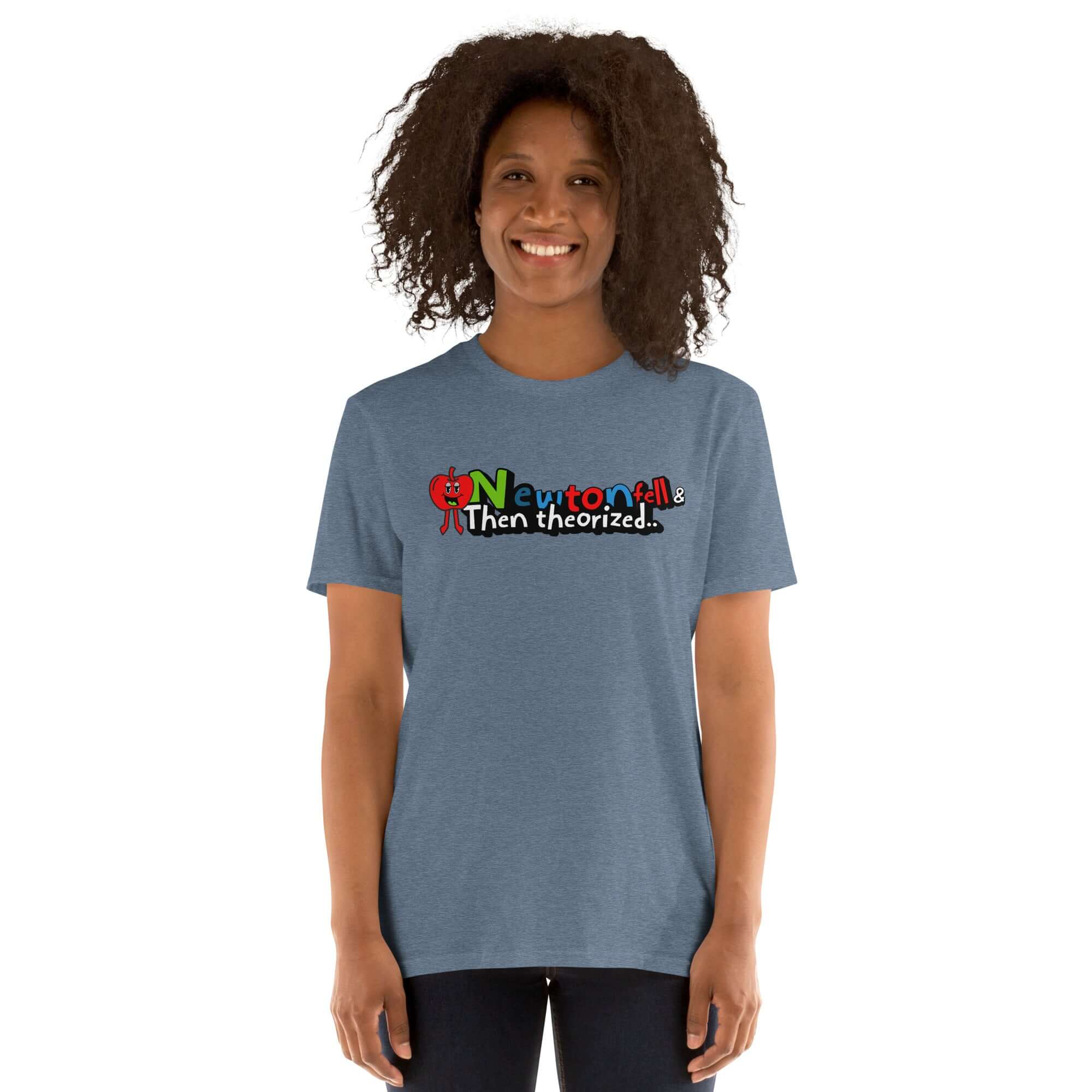 Person wearing "Newton Fell & Then Theorized" t-shirt with cartoon apple, celebrating physics history and humor.