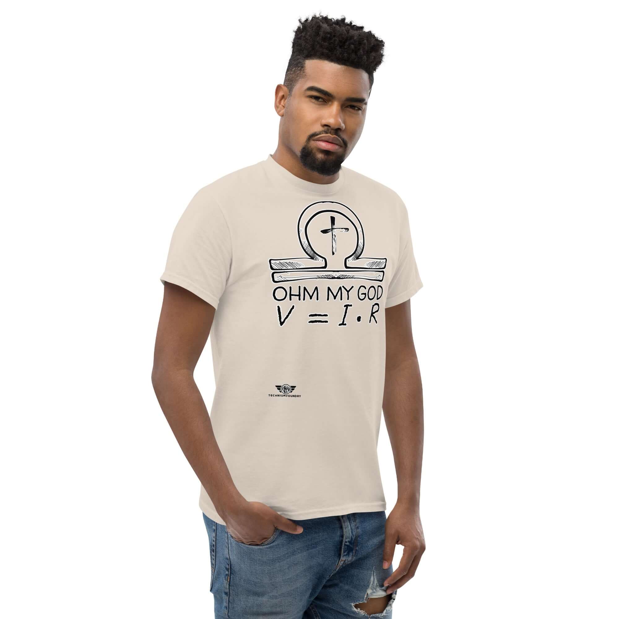 Man wearing 'Ohm My God' t-shirt featuring Christian ankh as omega symbol, blending Ohm's Law with religious humor.