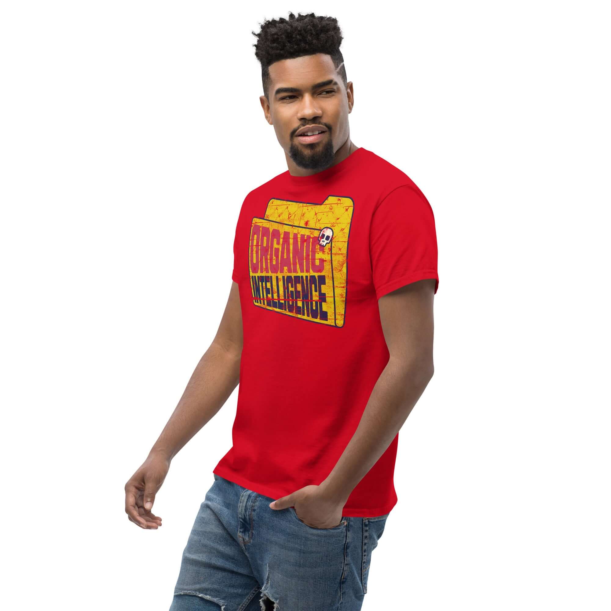Red Organic Intelligence T-shirt featuring weathered computer file icon design with anti-AI humor theme, modeled by a standing man.