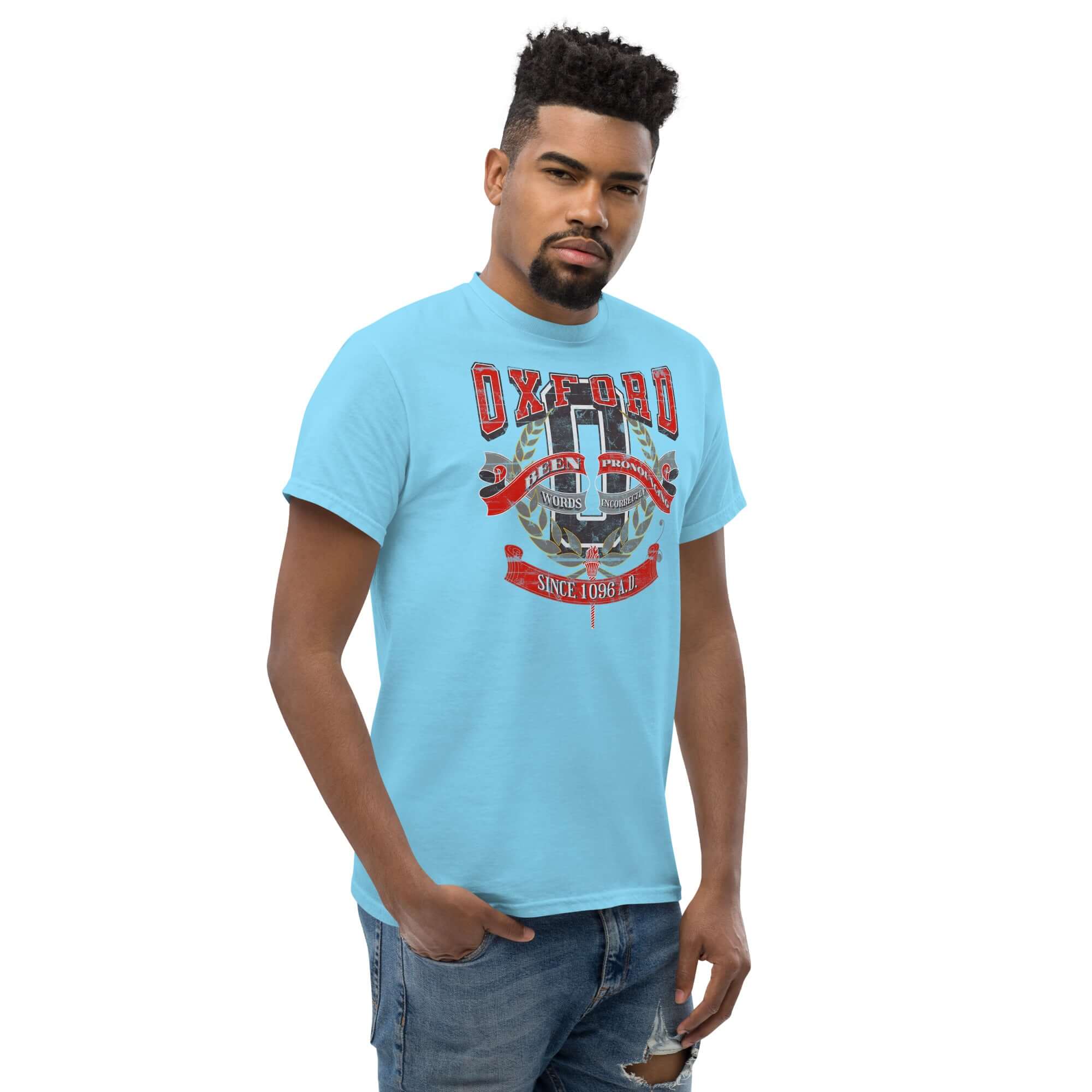 Oxford Pronunciation Parody T-Shirt with humorous design on pronunciation mistakes, modeled by a person in a blue shirt.