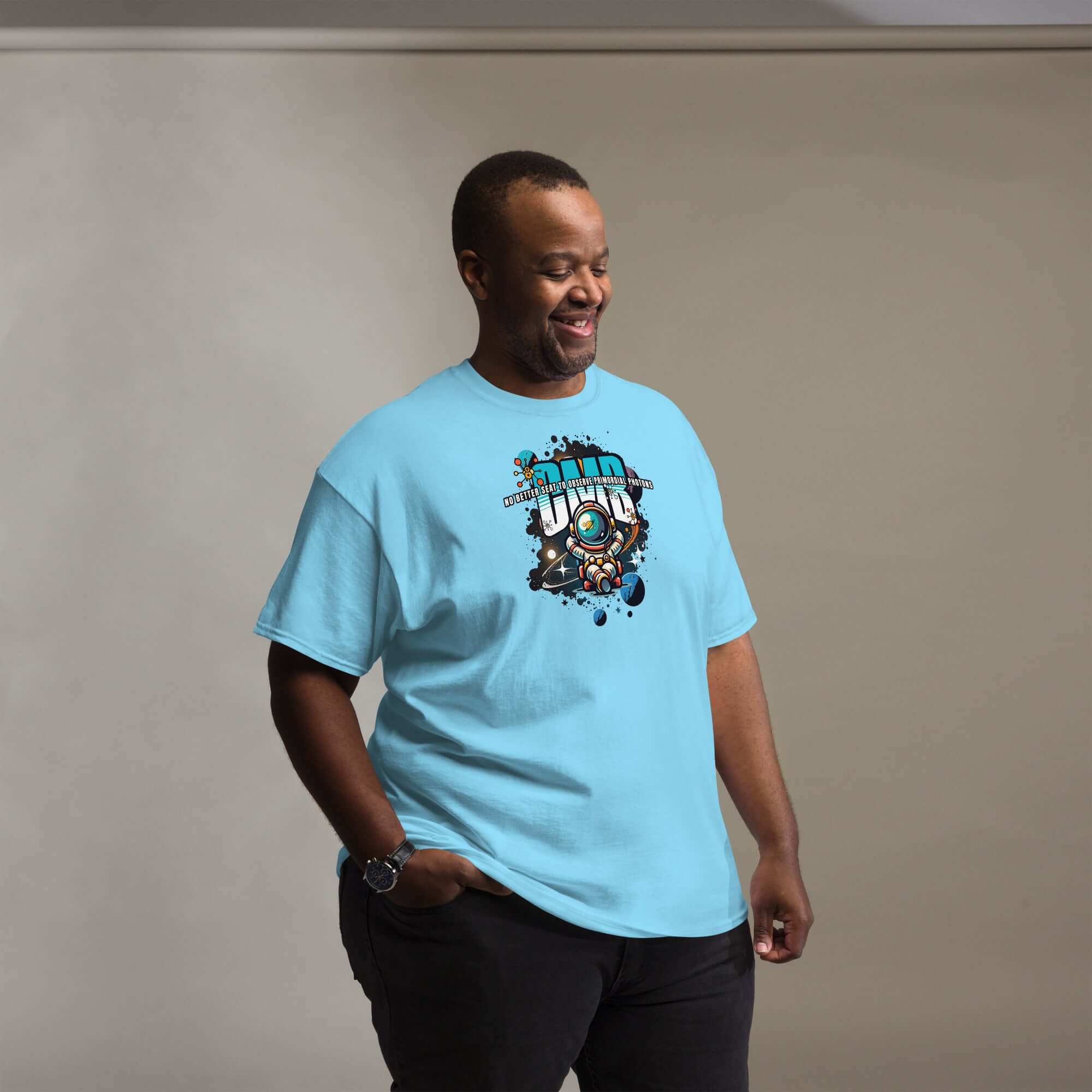 Man wearing a Primordial Photons Science T-Shirt with astronaut and space design.